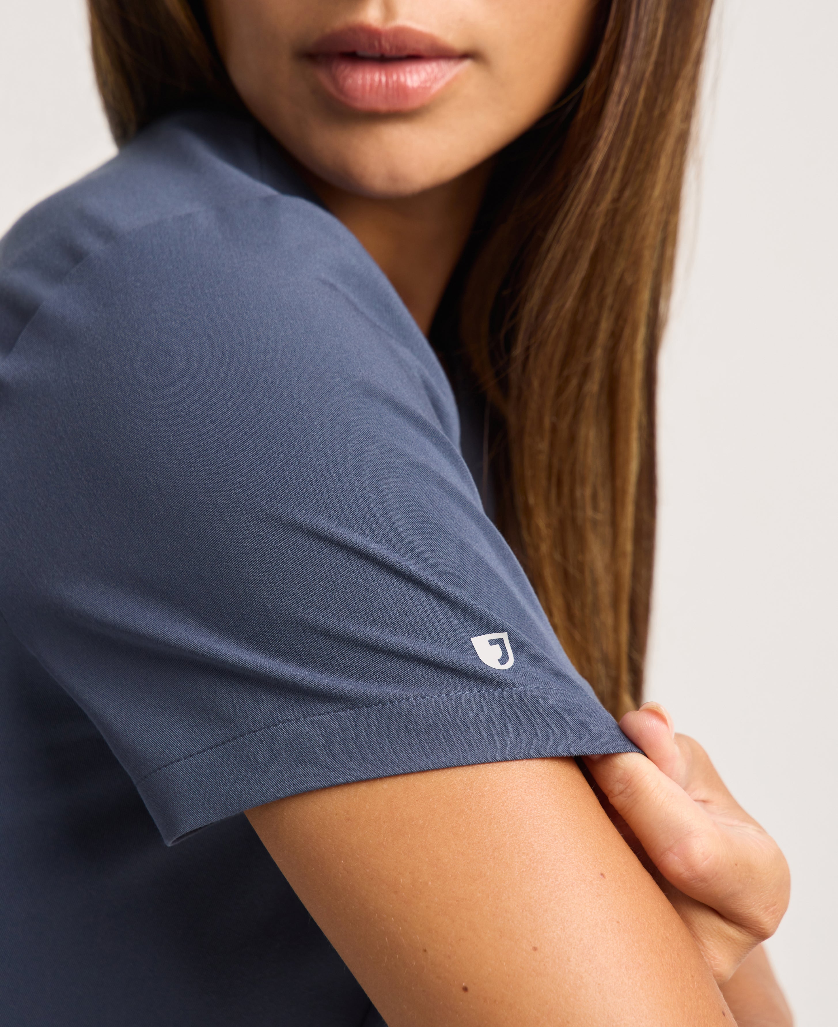 Jaanuu Calix Fit & Flare Scrub Top in Carbon Gray, product photo 3 of 6