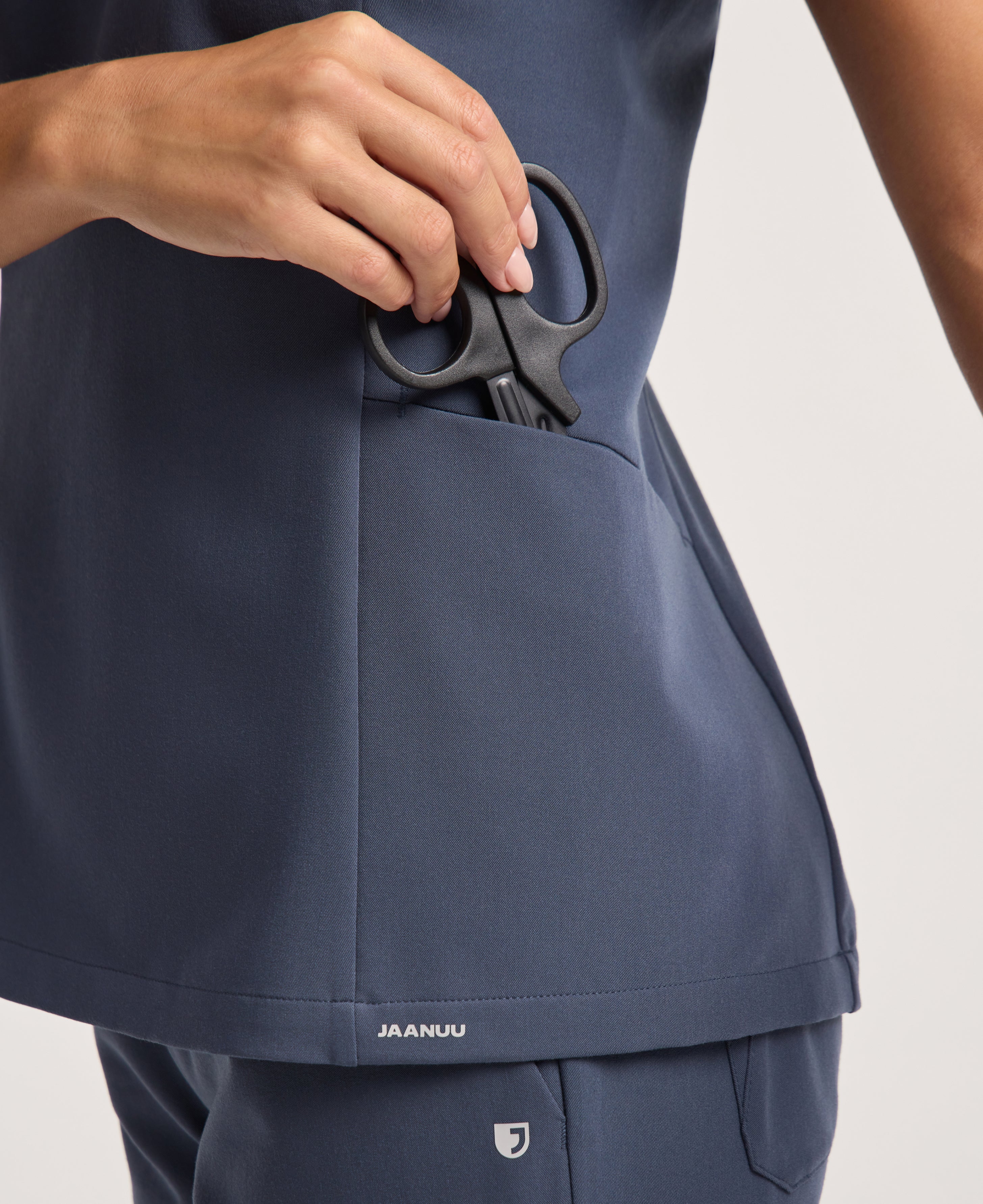 Jaanuu Calix Fit & Flare Scrub Top in Carbon Gray, product photo 5 of 6