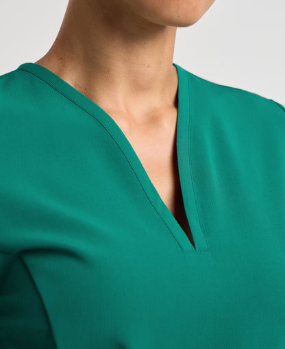 Jaanuu Calix Fit & Flare Scrub Top in Hunter Green, product photo 3 of 6
