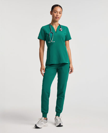 Jaanuu Calix Fit & Flare Scrub Top in Hunter Green, product photo 4 of 6