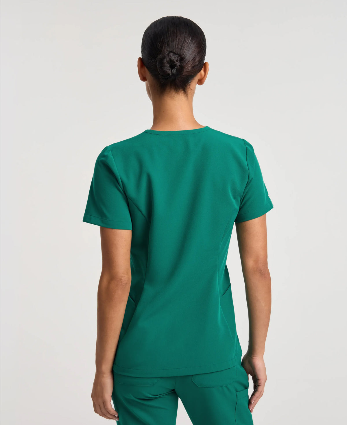 Jaanuu Calix Fit & Flare Scrub Top in Hunter Green, product photo 5 of 6