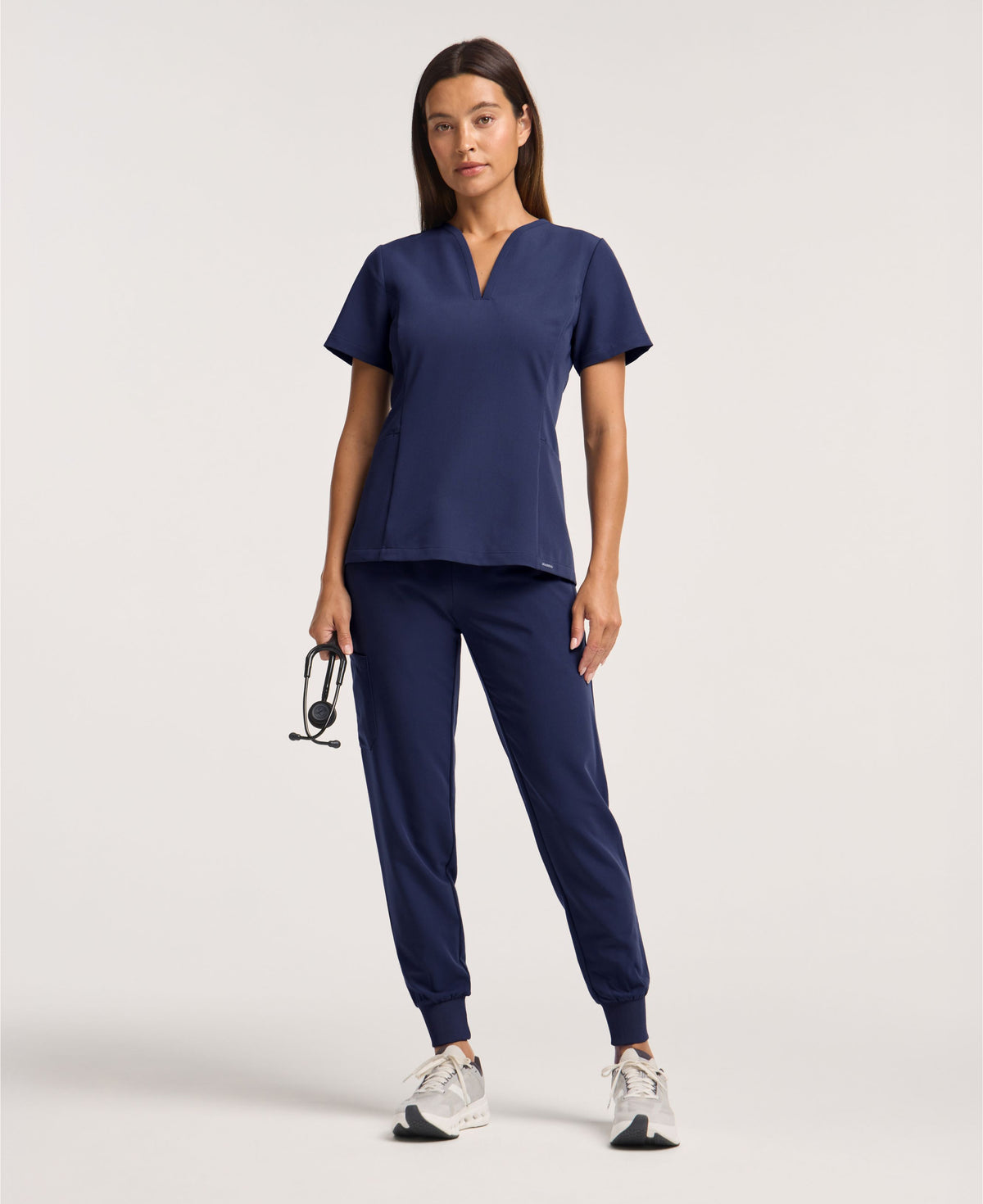 Jaanuu Calix Fit & Flare Scrub Top in Midnight Navy, product photo 1 of 6