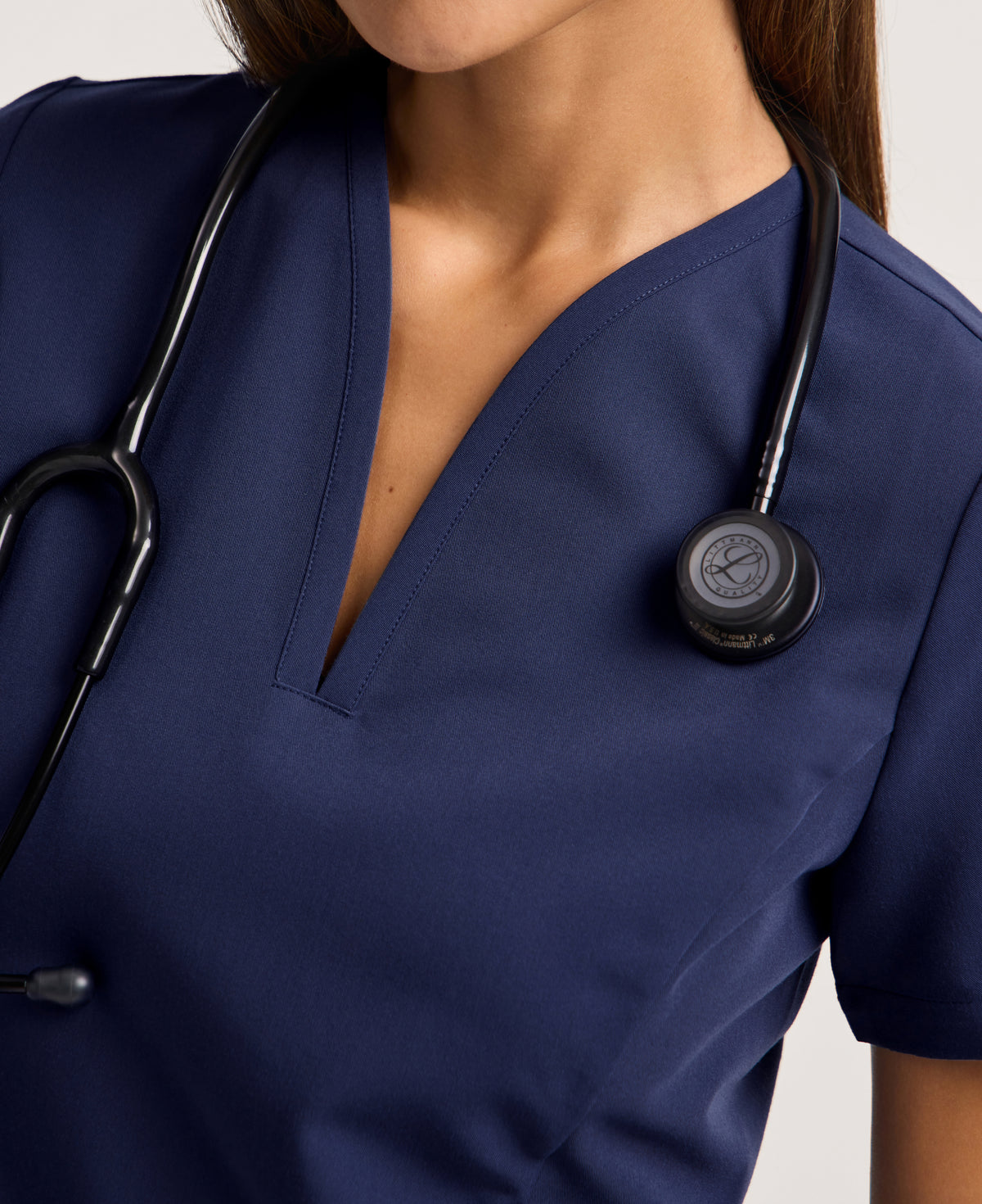 Jaanuu Calix Fit & Flare Scrub Top in Midnight Navy, product photo 2 of 6