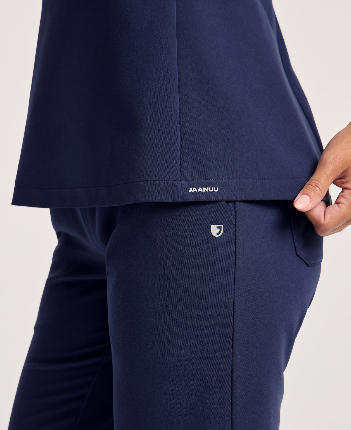 Jaanuu Calix Fit & Flare Scrub Top in Midnight Navy, product photo 6 of 6
