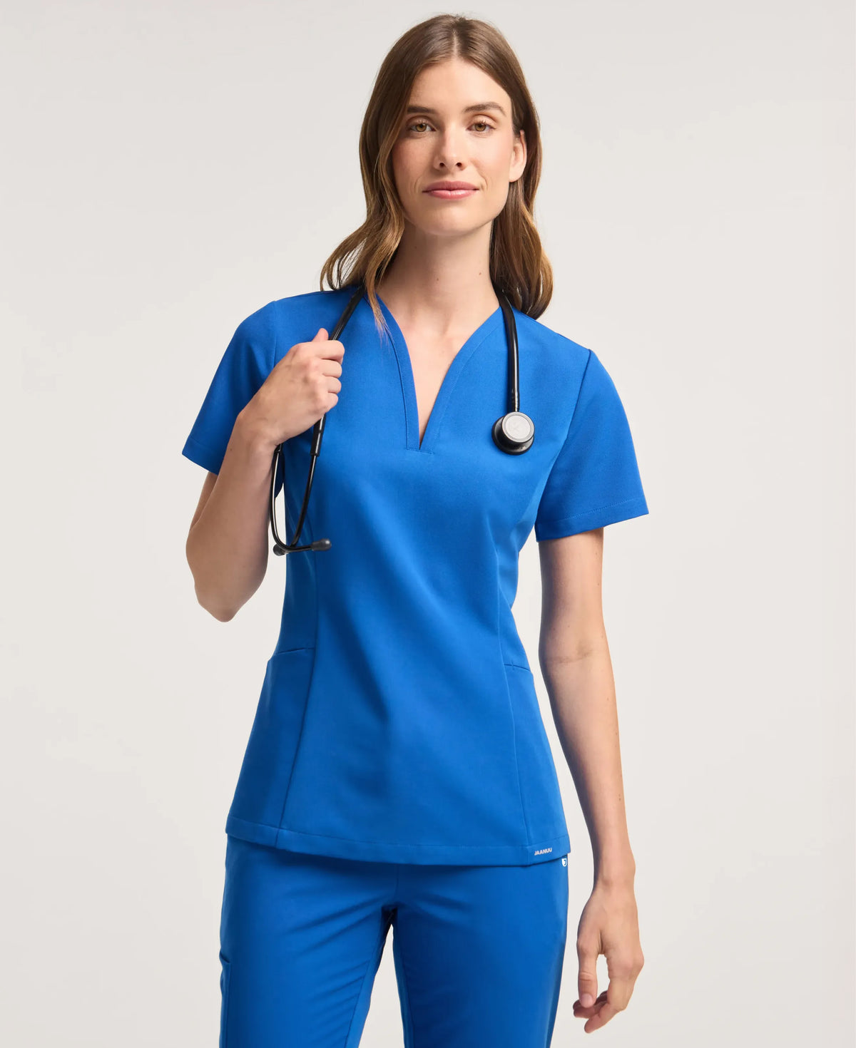 Jaanuu Calix Fit & Flare Scrub Top in Royal Blue, product photo 1 of 6