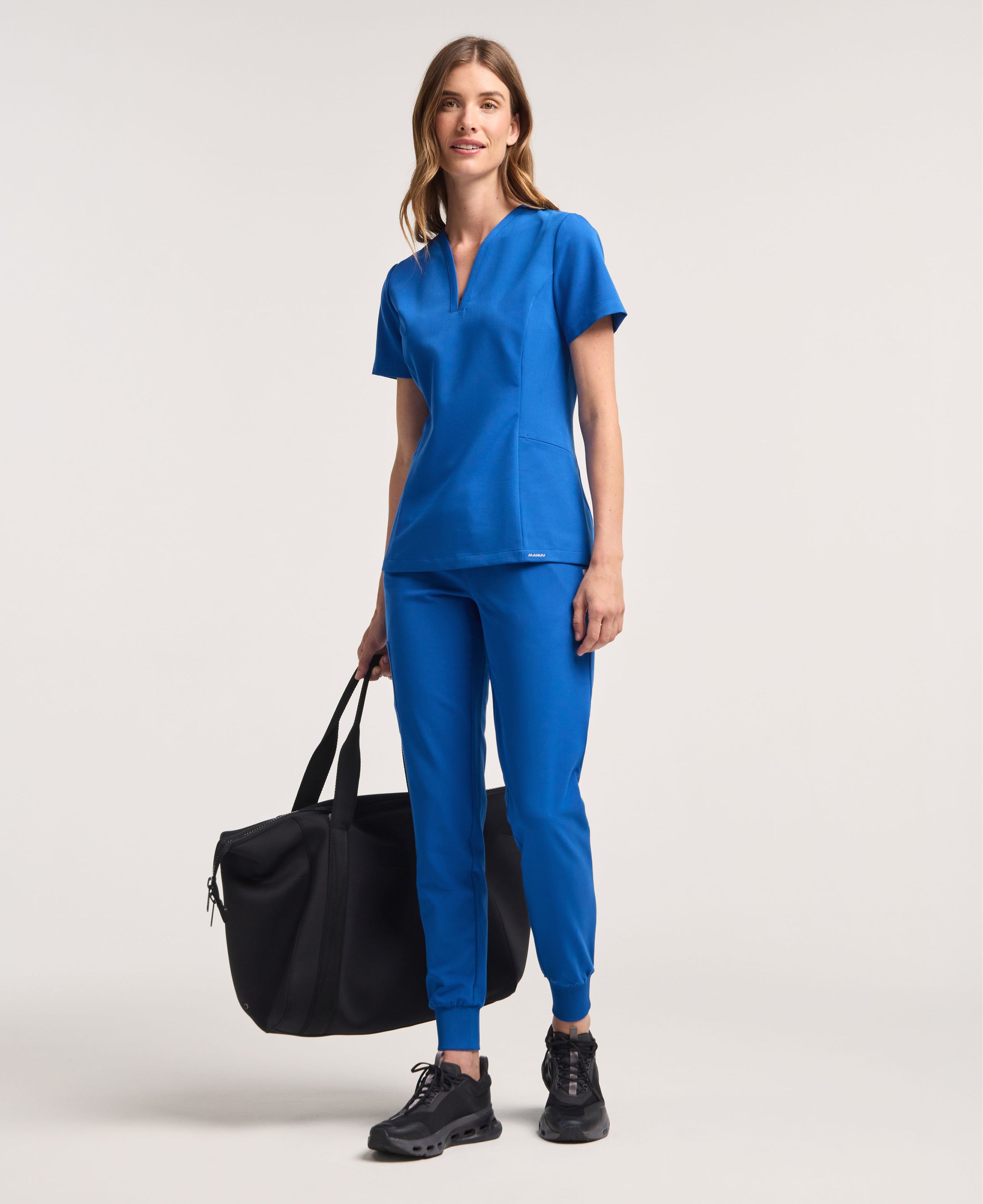Jaanuu Calix Fit & Flare Scrub Top in Royal Blue, product photo 2 of 6