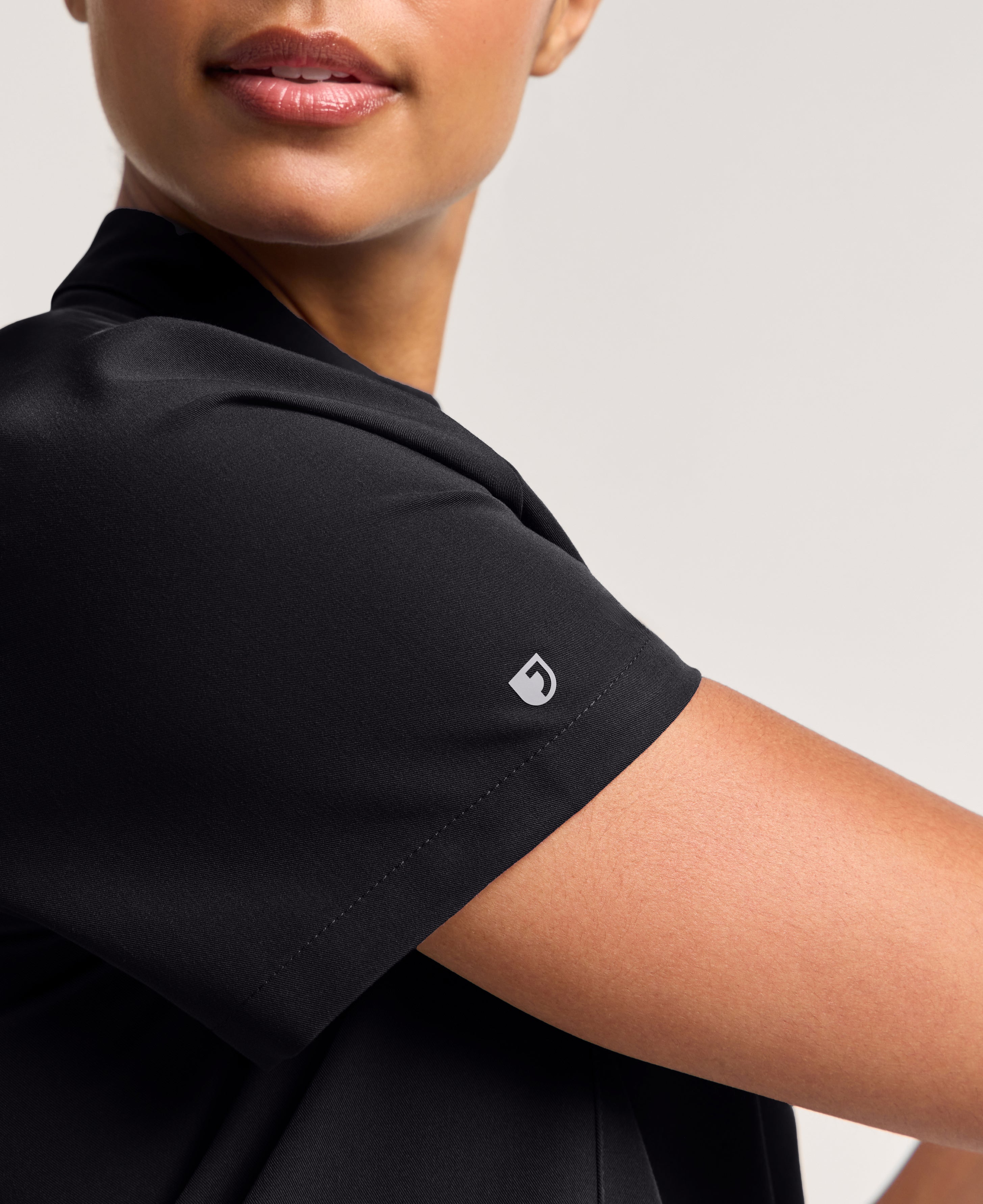 Jaanuu Savi Stand-Collar Scrub Top in Black, product photo 5 of 6