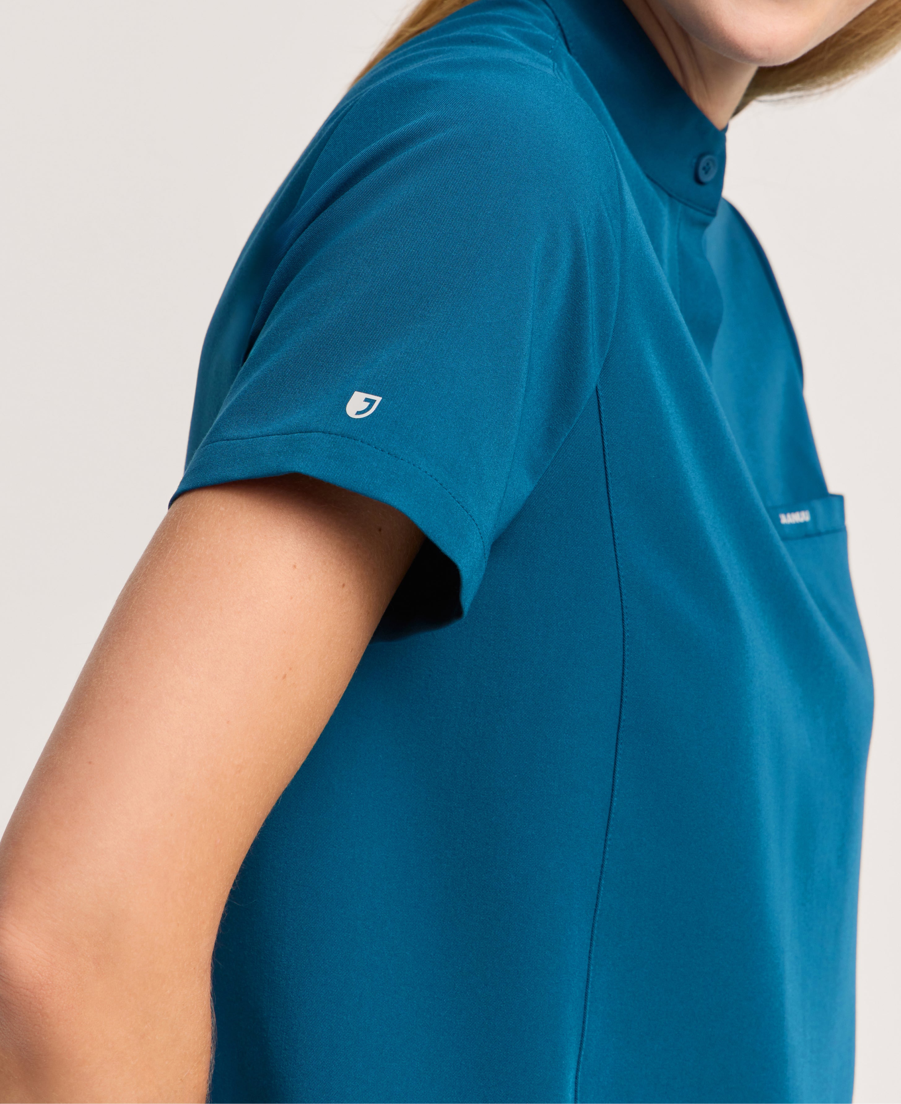 Jaanuu Savi Stand-Collar Scrub Top in Caribbean Blue, product photo 5 of 6