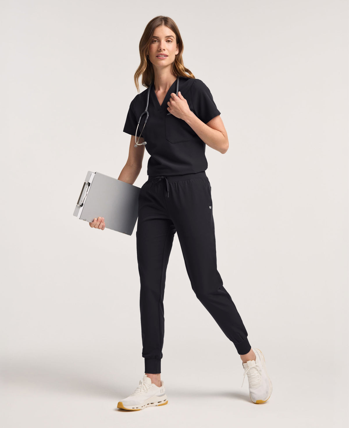 Jaanuu Rhena Slim 1-Pocket Scrub Top in Black, product photo 1 of 6