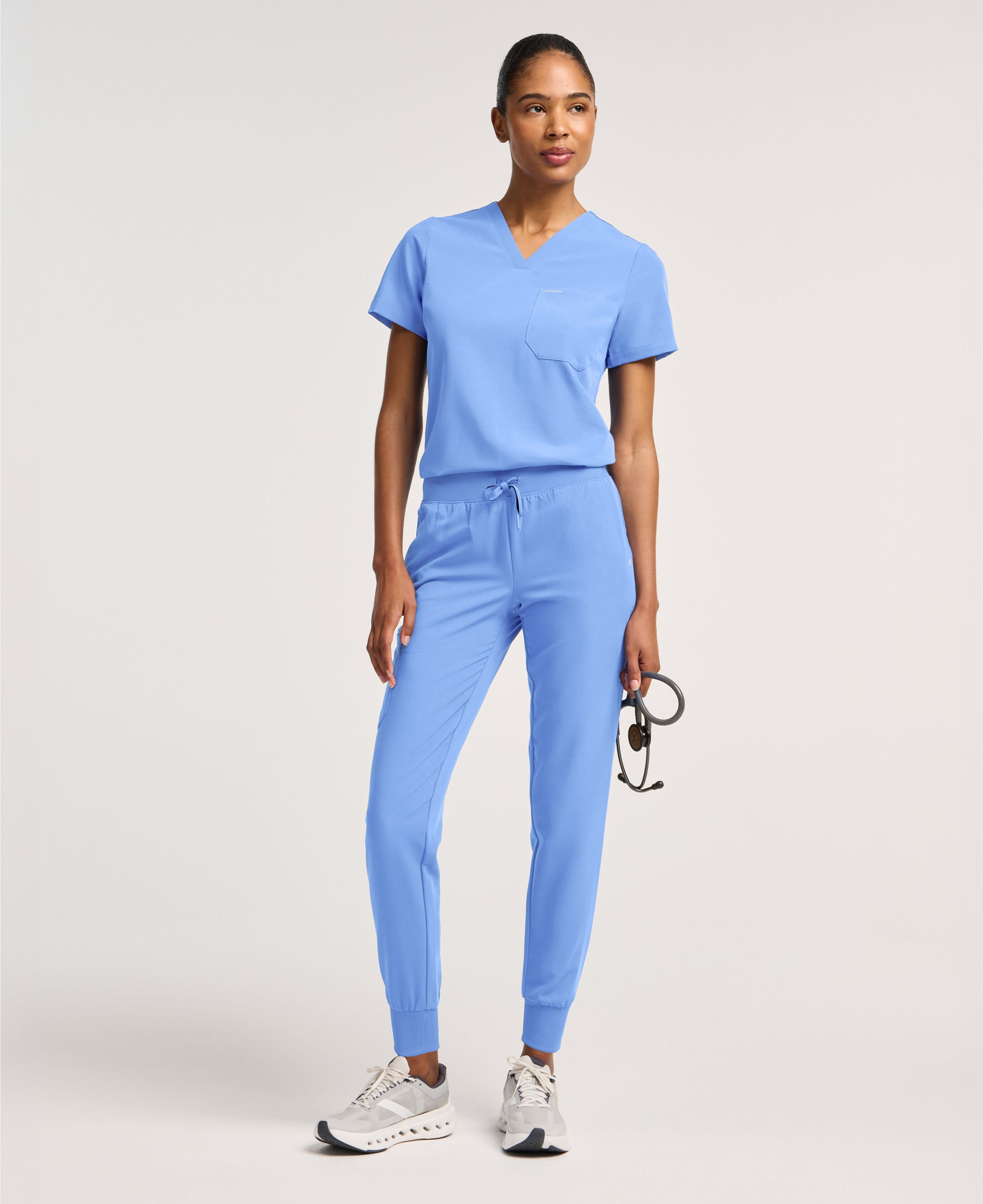 Jaanuu Rhena Slim 1-Pocket Scrub Top in Ceil Blue, product photo 1 of 6