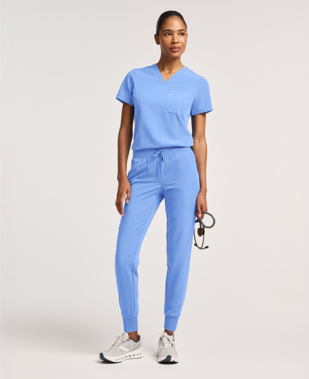 Jaanuu Rhena Slim 1-Pocket Scrub Top in Ceil Blue, product photo 1 of 6