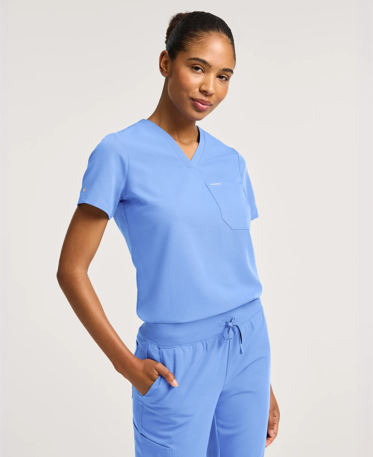 Jaanuu Rhena Slim 1-Pocket Scrub Top in Ceil Blue, product photo 2 of 6