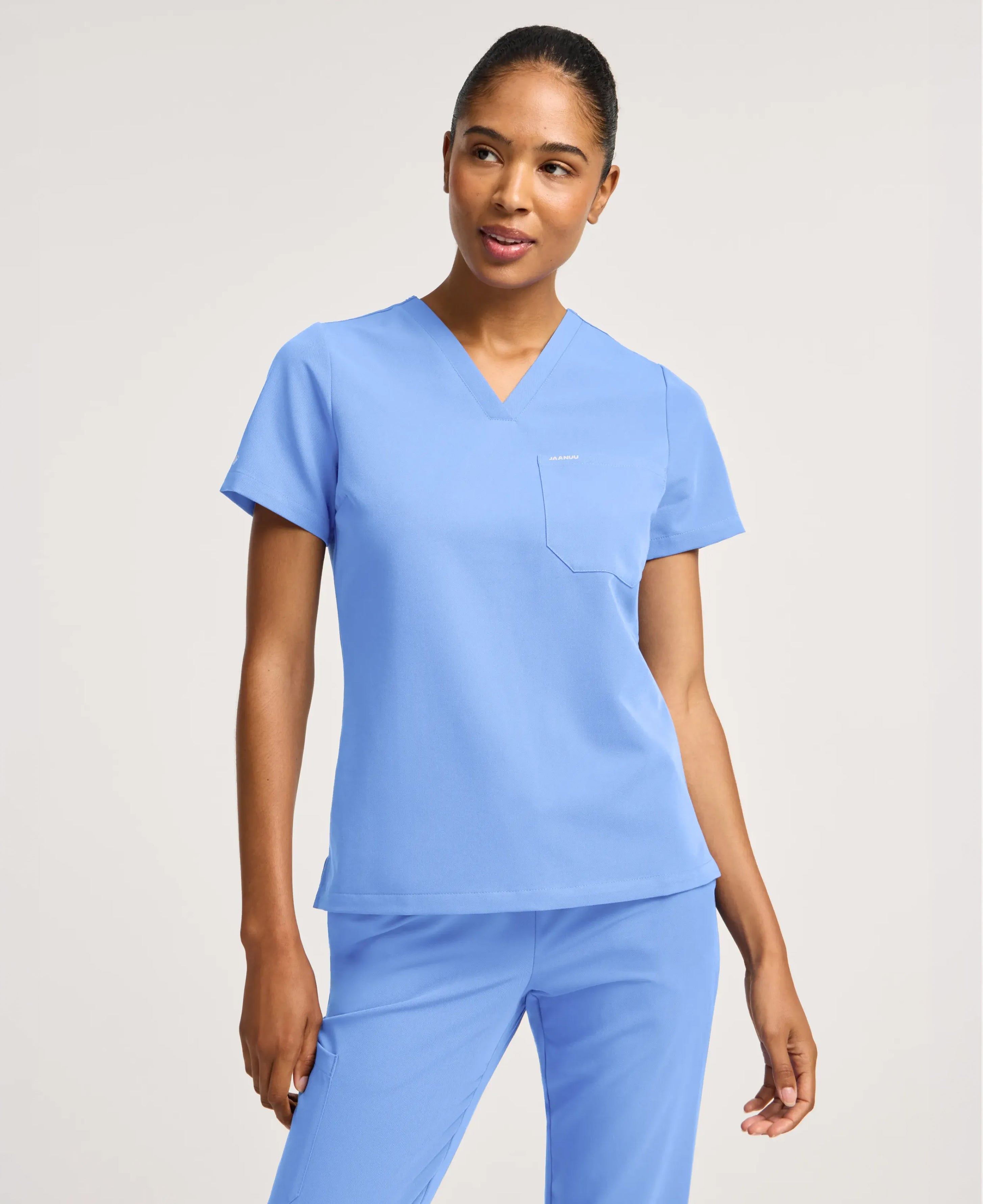 Jaanuu Rhena Slim 1-Pocket Scrub Top in Ceil Blue, product photo 3 of 6
