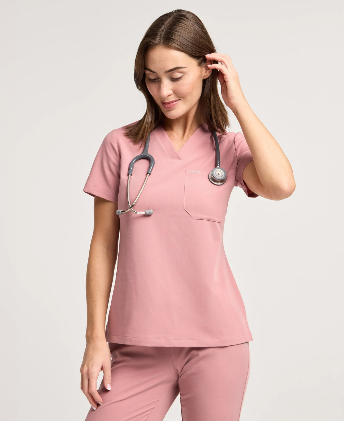 Jaanuu Rhena Slim 1-Pocket Scrub Top in Mauve, product photo 1 of 6