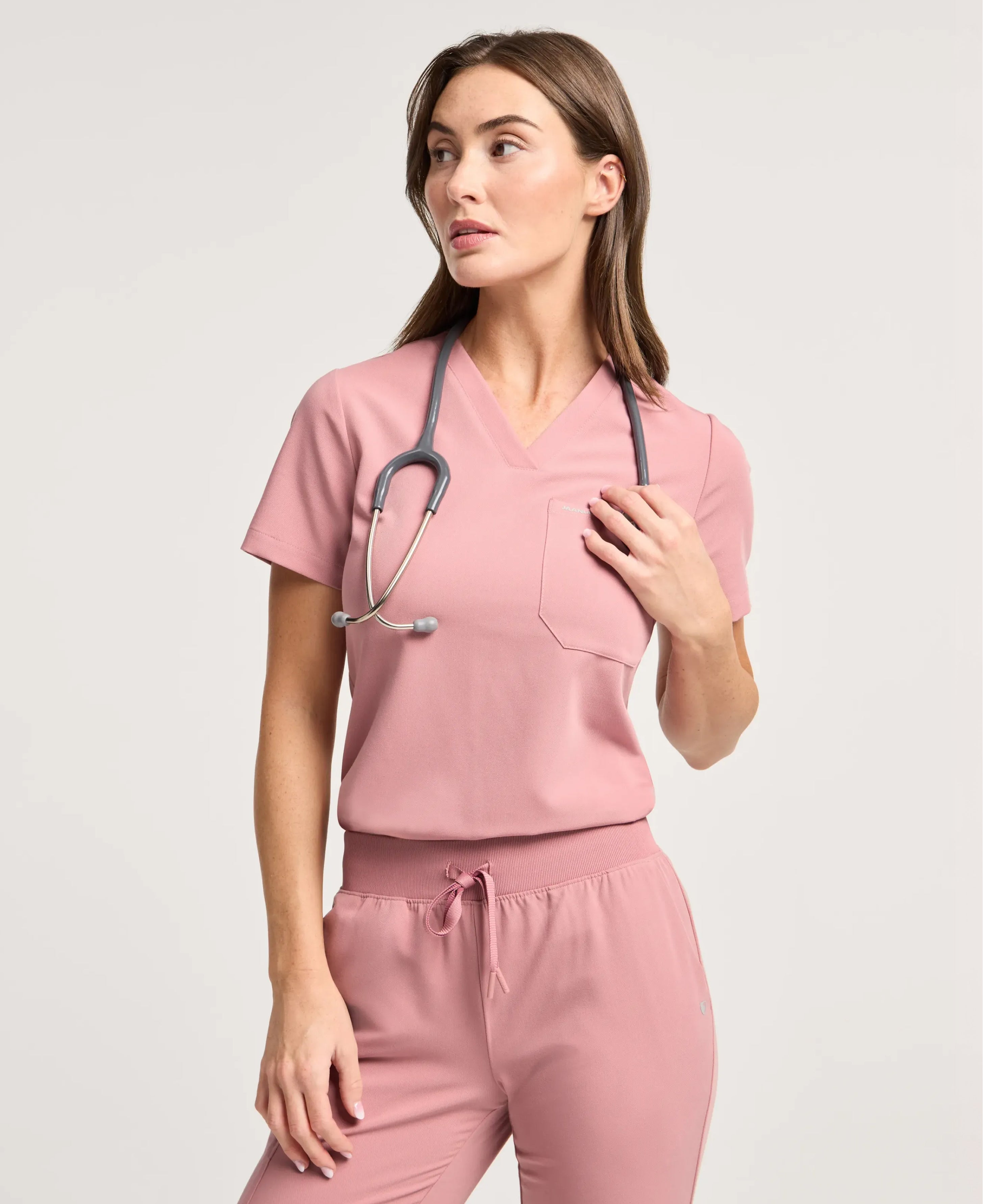 Jaanuu Rhena Slim 1-Pocket Scrub Top in Mauve, product photo 3 of 6