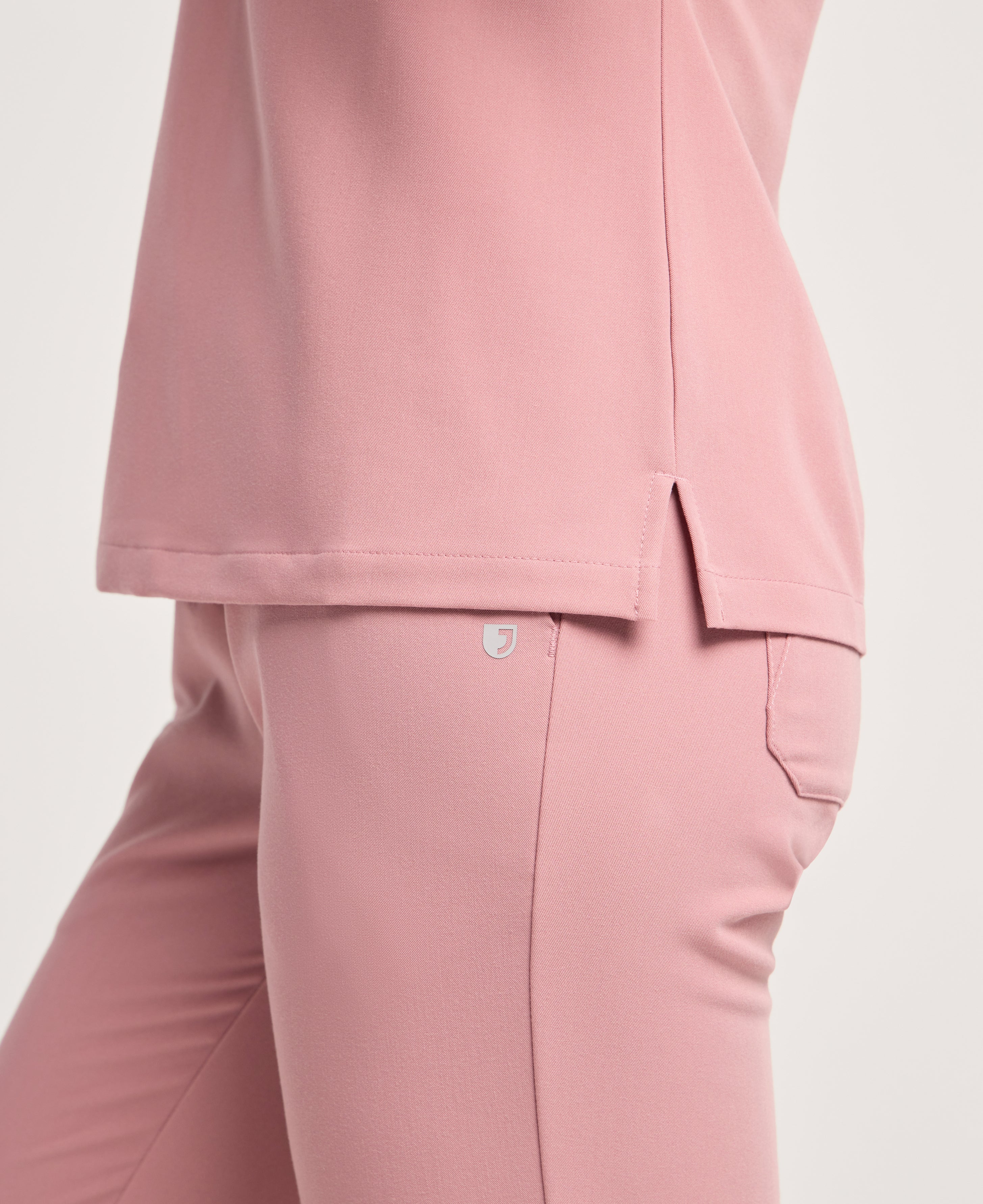 Jaanuu Rhena Slim 1-Pocket Scrub Top in Mauve, product photo 5 of 6