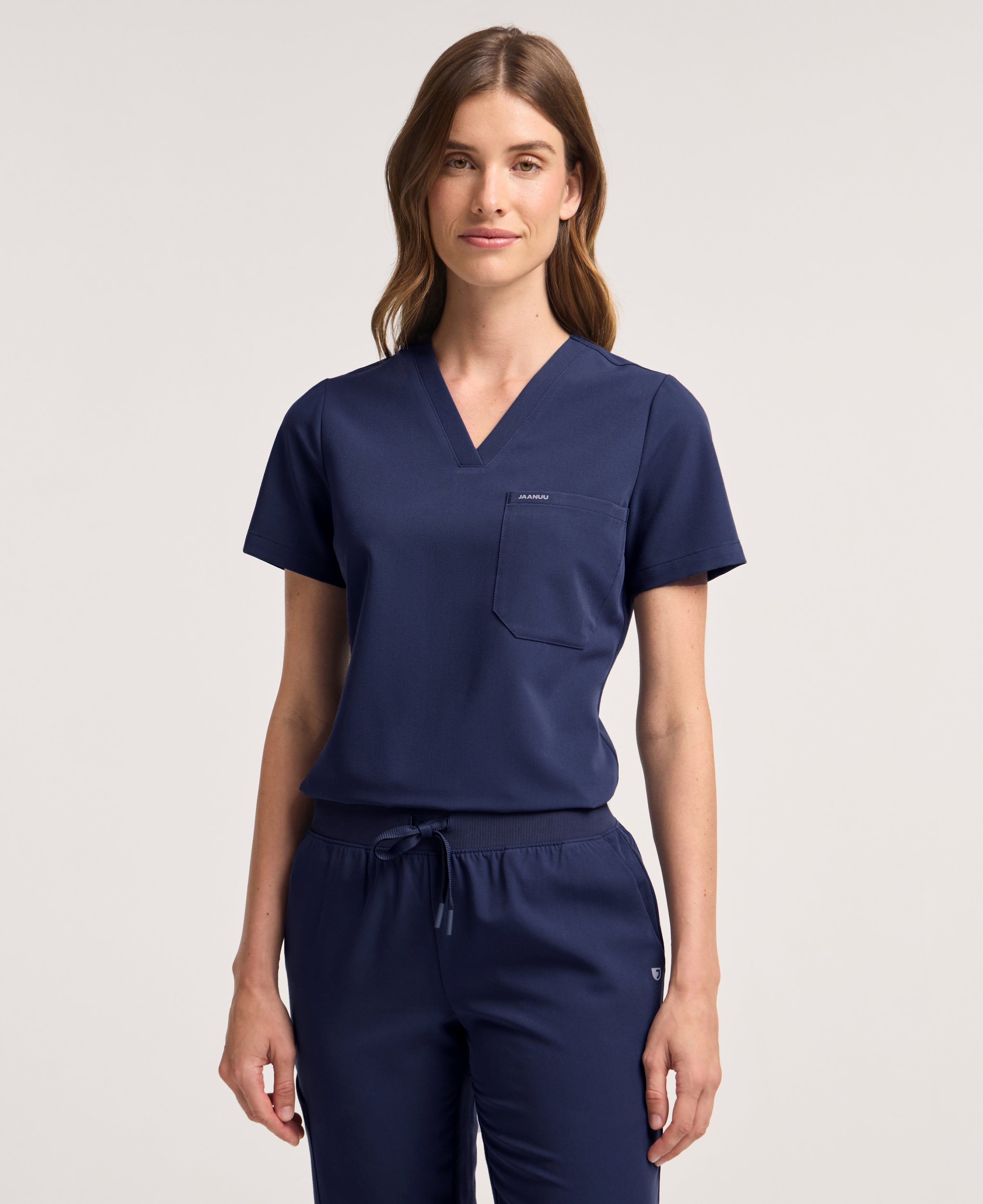 Jaanuu Rhena Slim 1-Pocket Scrub Top in Midnight Navy, product photo 3 of 6