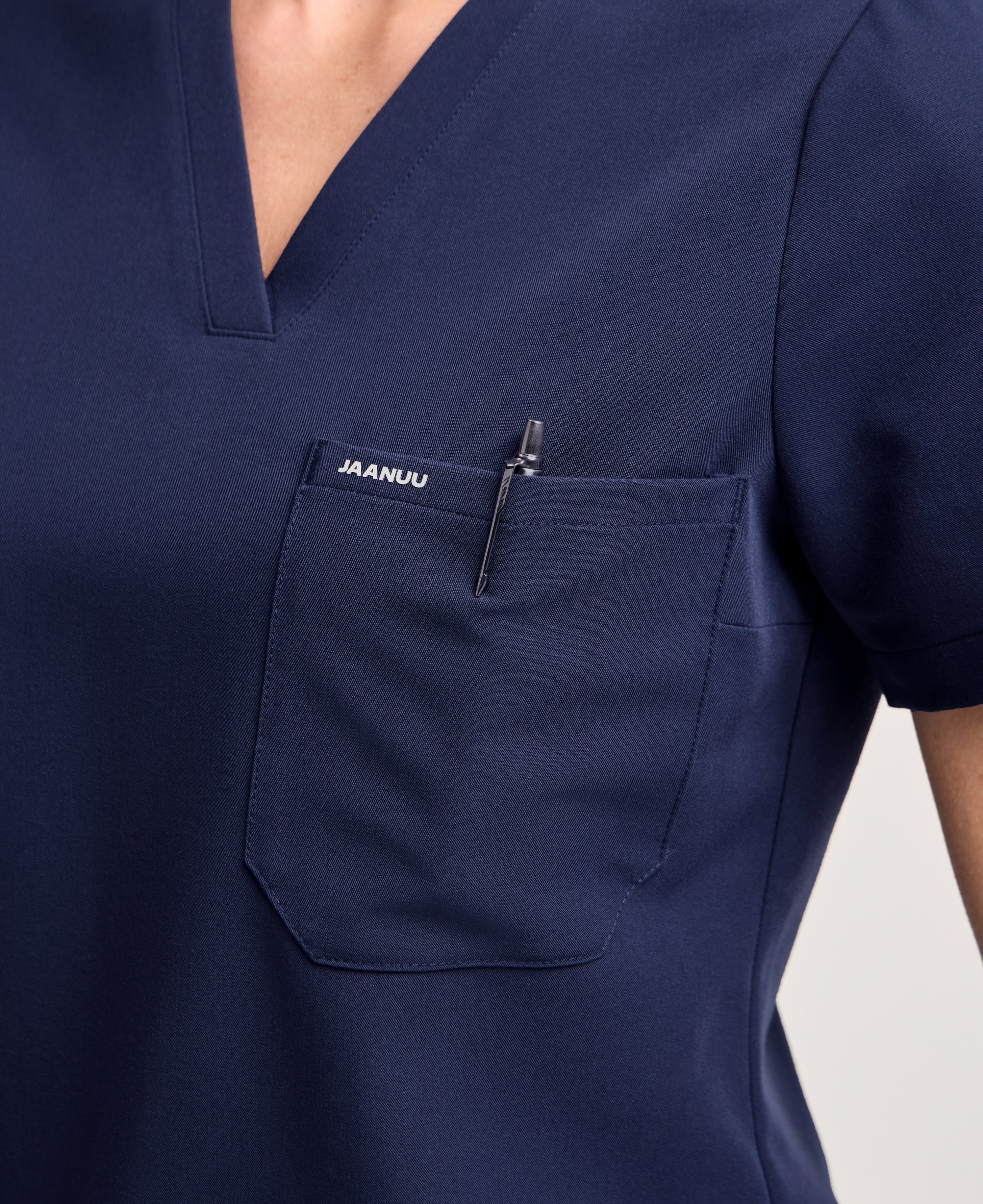 Jaanuu Rhena Slim 1-Pocket Scrub Top in Midnight Navy, product photo 4 of 6