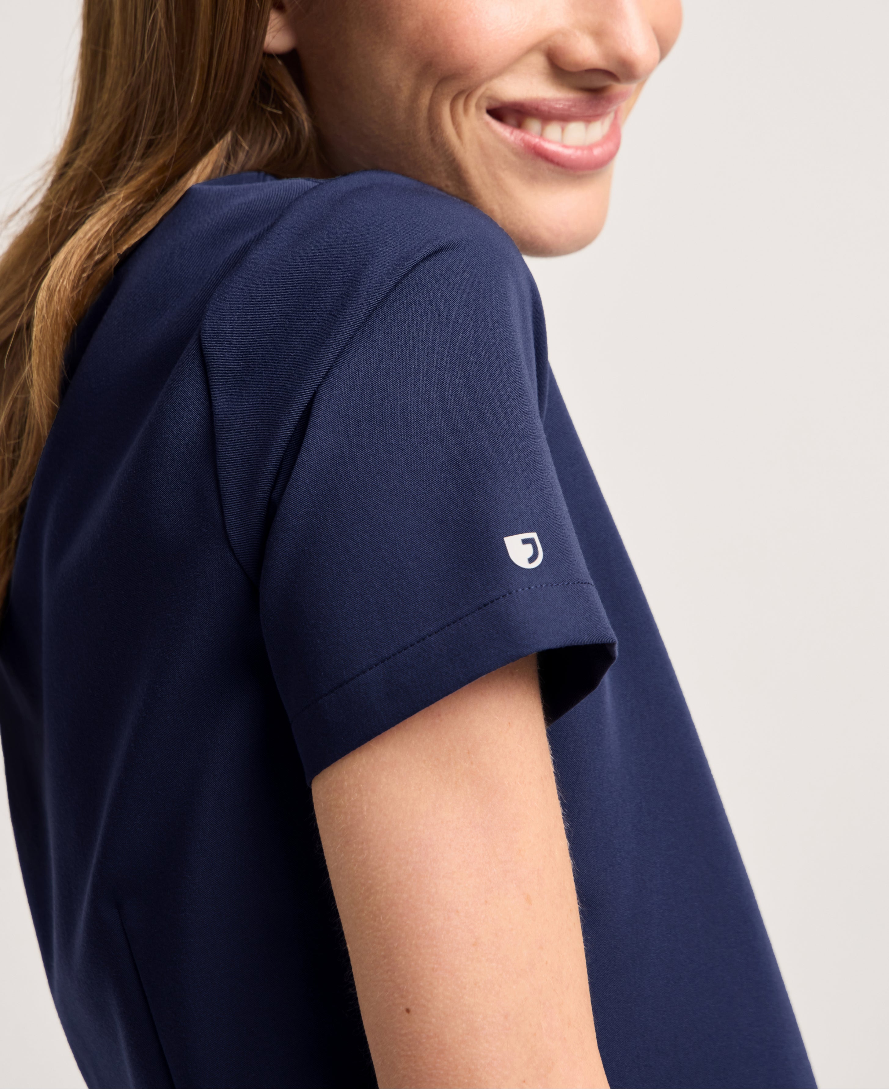 Jaanuu Rhena Slim 1-Pocket Scrub Top in Midnight Navy, product photo 5 of 6