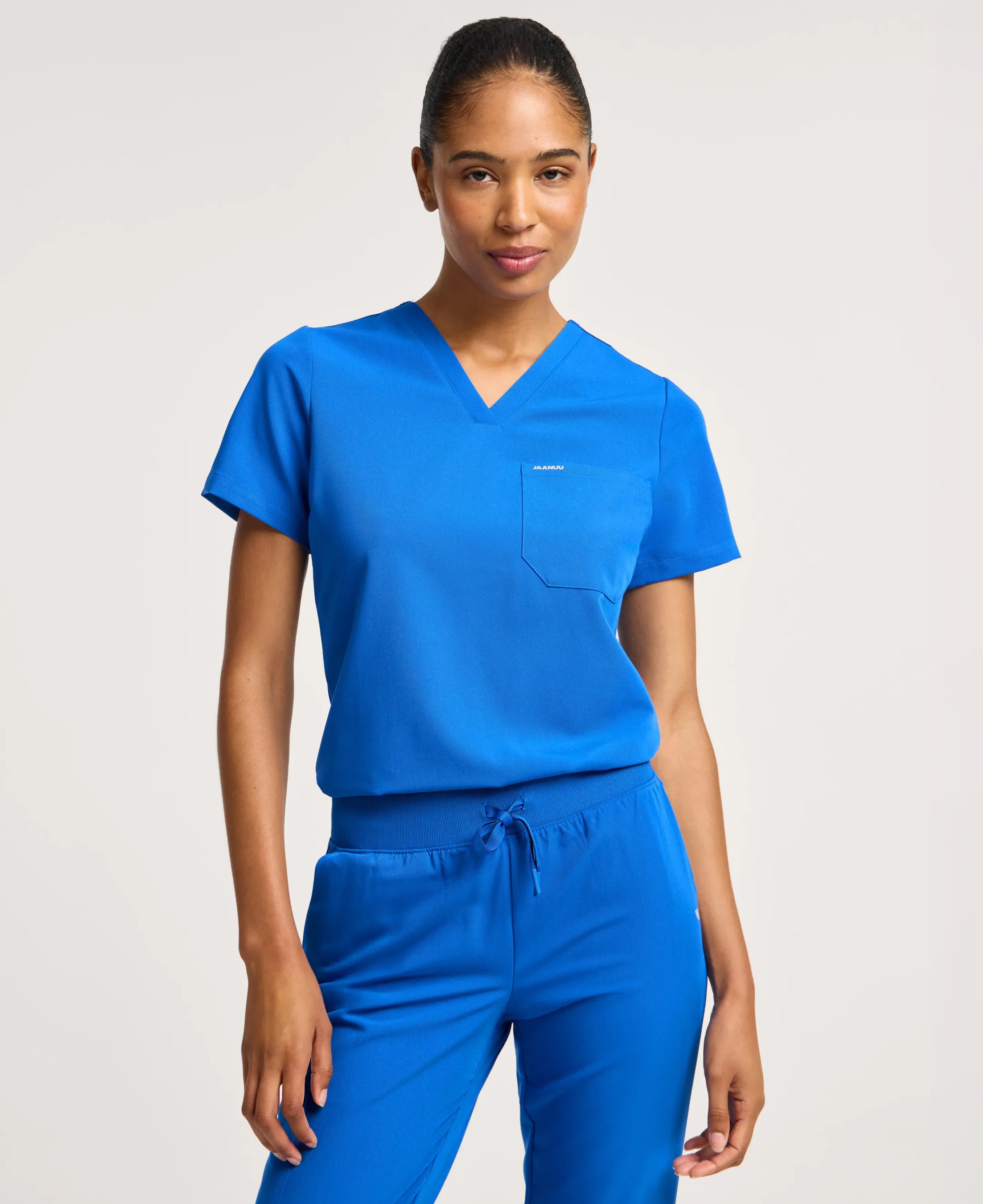 Jaanuu Rhena Slim 1-Pocket Scrub Top in Royal Blue, product photo 1 of 6