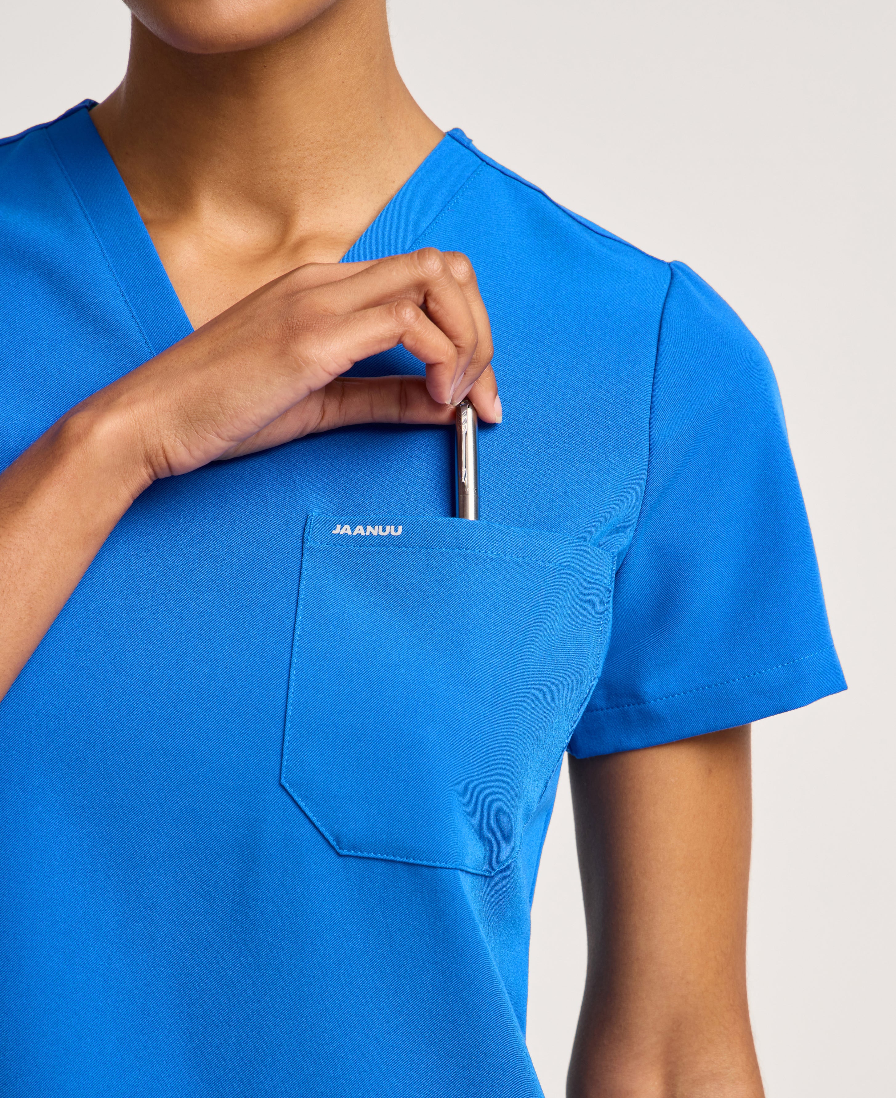 Jaanuu Rhena Slim 1-Pocket Scrub Top in Royal Blue, product photo 3 of 6