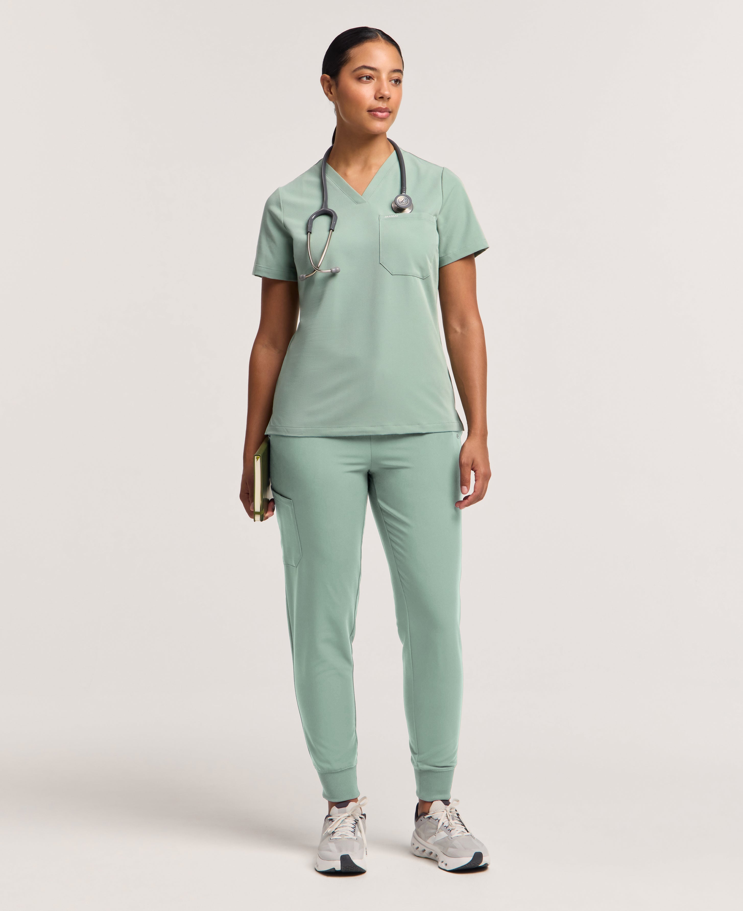 Jaanuu Rhena Slim 1-Pocket Scrub Top in Sage, product photo 2 of 6