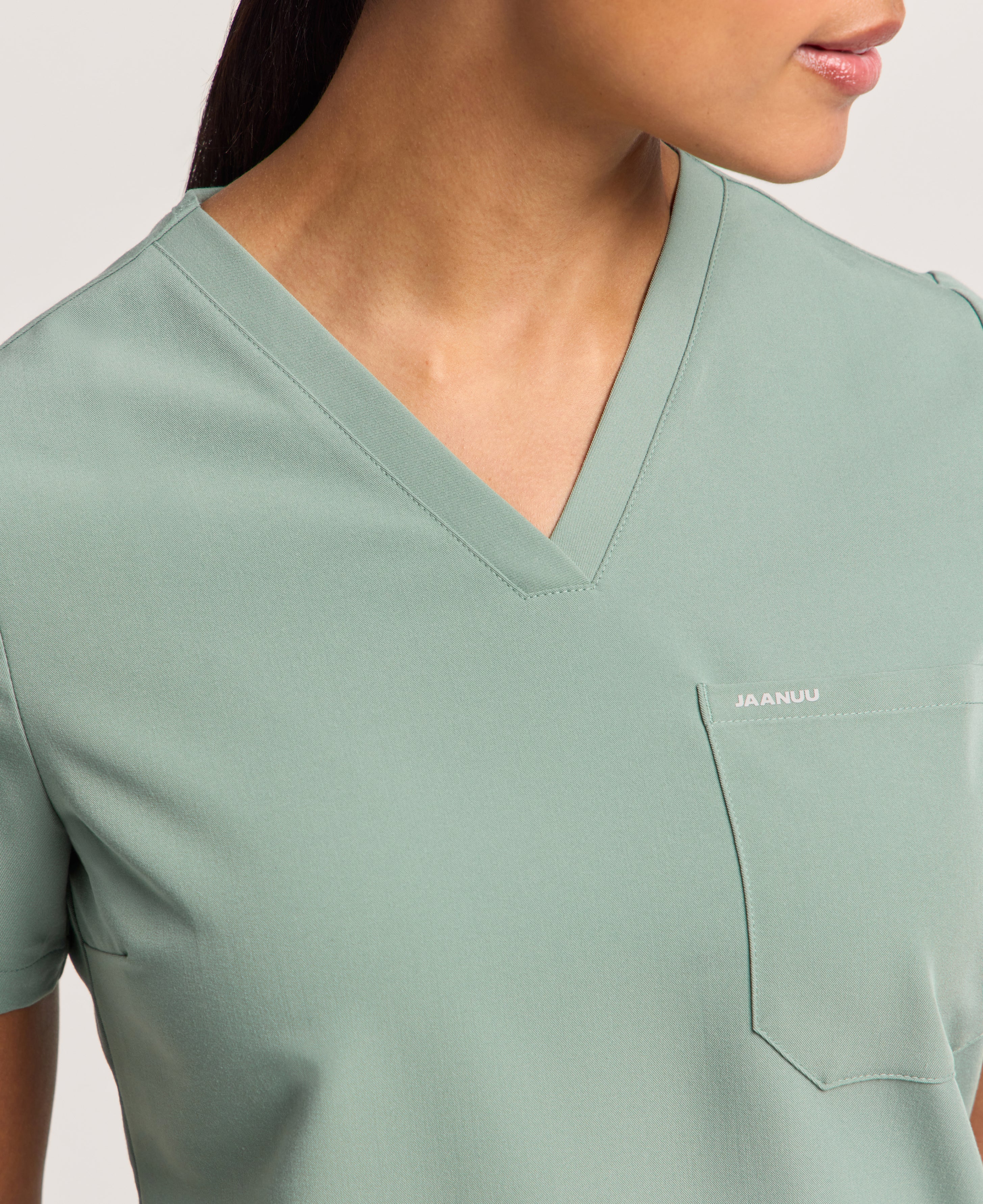 Jaanuu Rhena Slim 1-Pocket Scrub Top in Sage, product photo 4 of 6