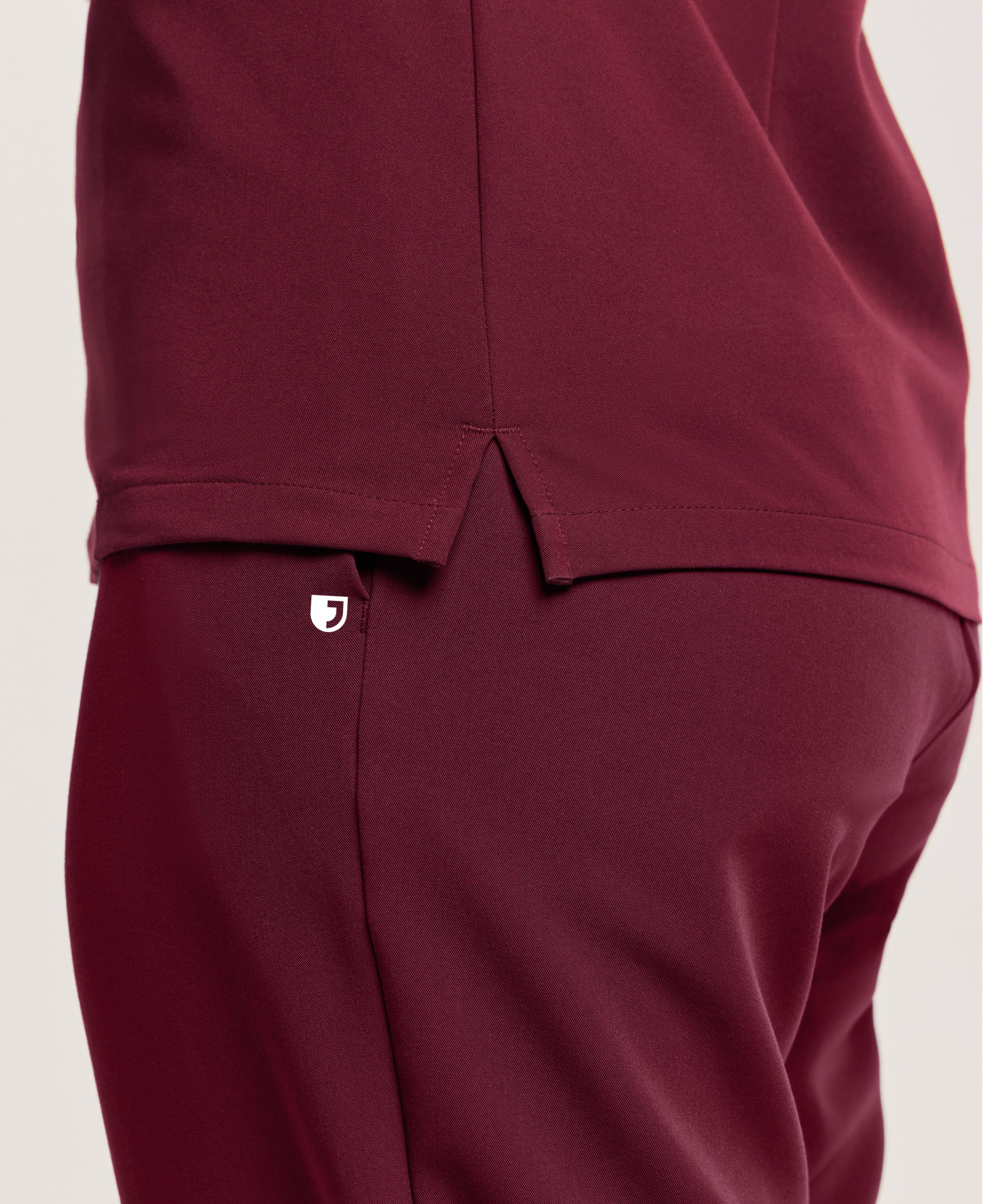 Jaanuu Helia Slim Notched V-Neck Scrub Top in Burgundy, product photo 6 of 6