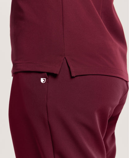 Jaanuu Helia Slim Notched V-Neck Scrub Top in Burgundy, product photo 6 of 6