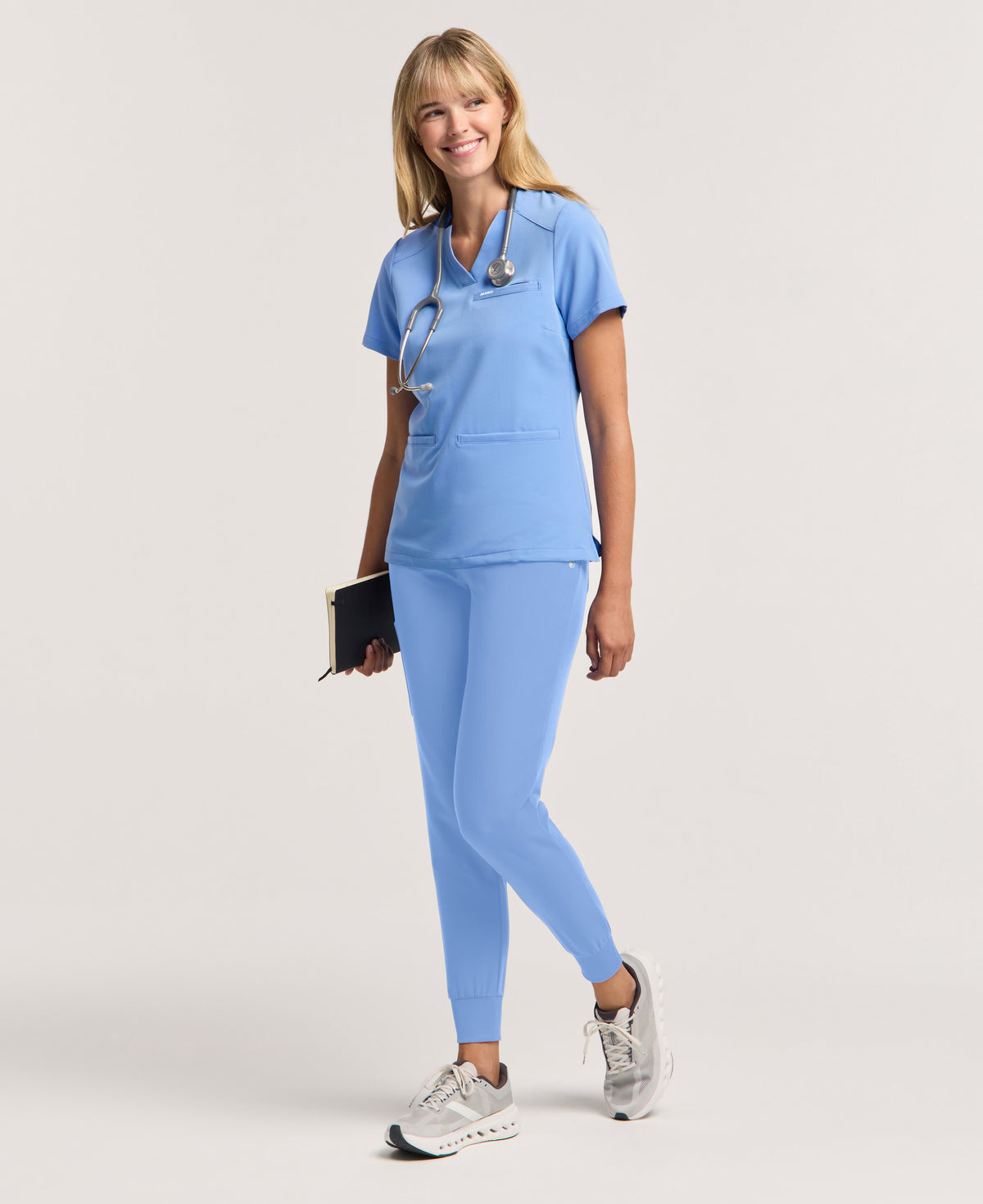 Jaanuu Helia Slim Notched V-Neck Scrub Top in Ceil Blue, product photo 1 of 6