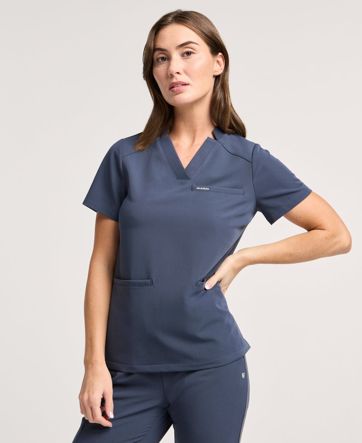 Jaanuu Helia Slim Notched V-Neck Scrub Top in Carbon Gray, product photo 1 of 6