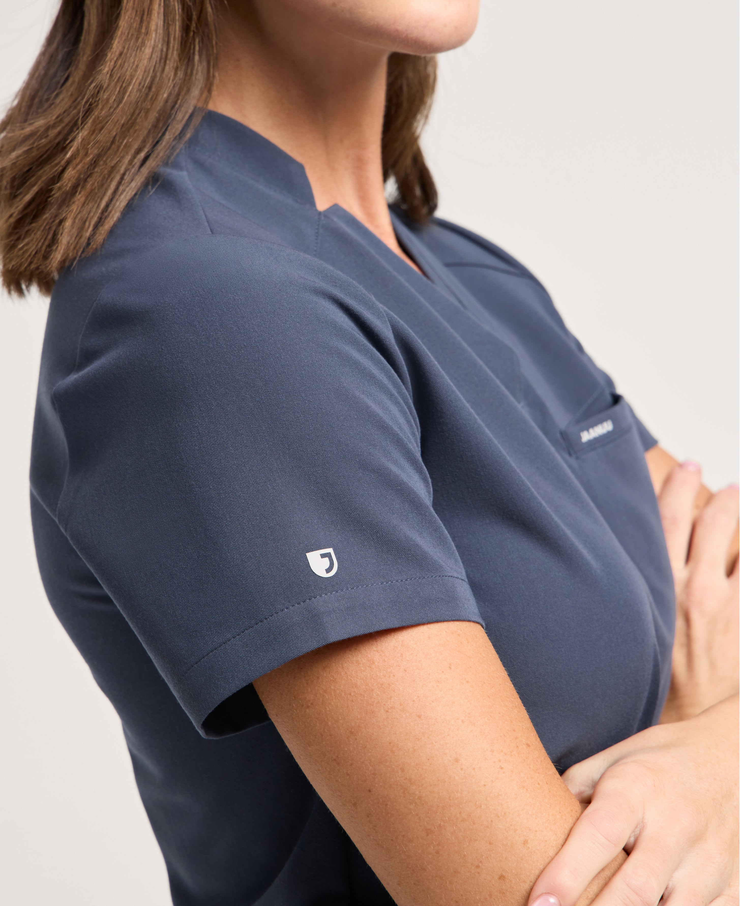 Jaanuu Helia Slim Notched V-Neck Scrub Top in Carbon Gray, product photo 6 of 6