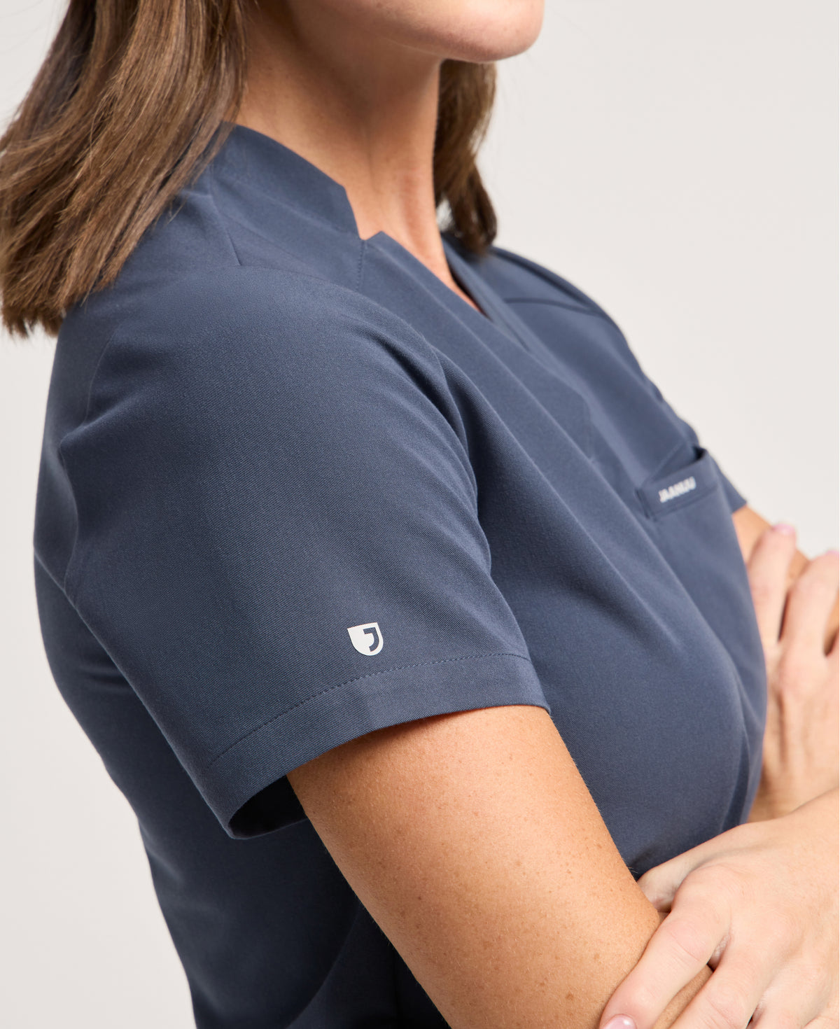 Jaanuu Helia Slim Notched V-Neck Scrub Top in Carbon Gray, product photo 6 of 6