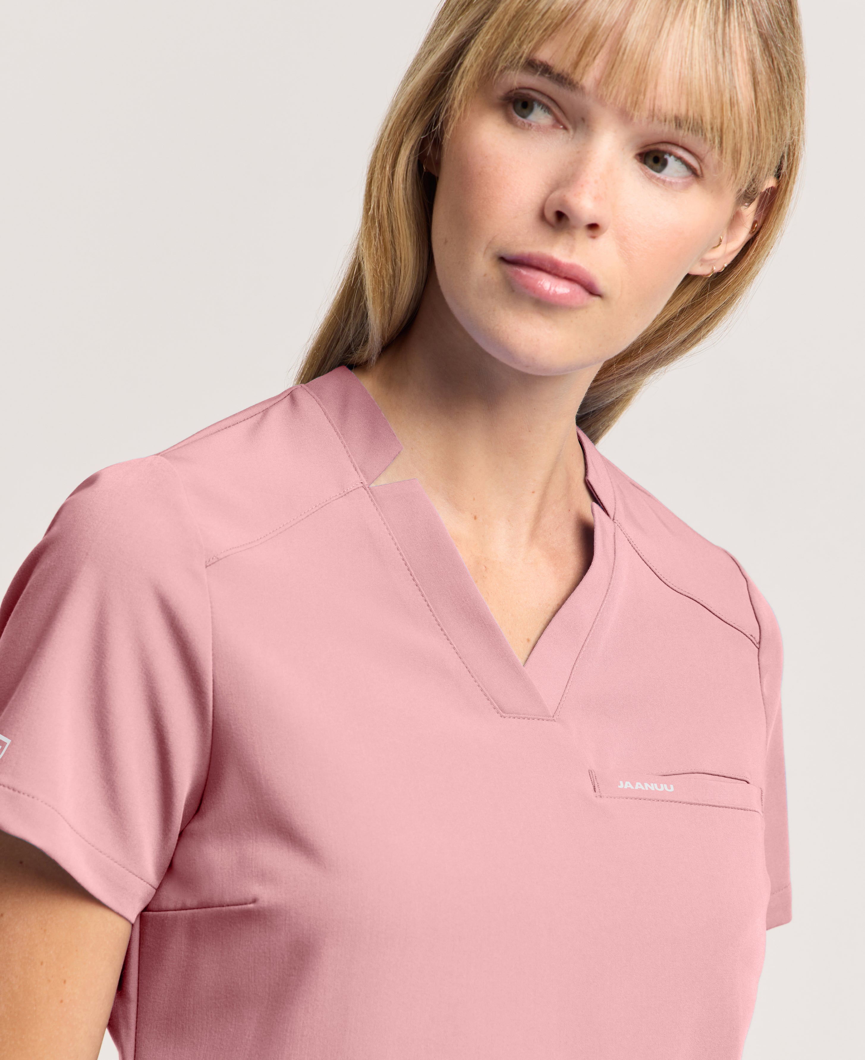 Jaanuu Helia Slim Notched V-Neck Scrub Top in Mauve, product photo 2 of 6