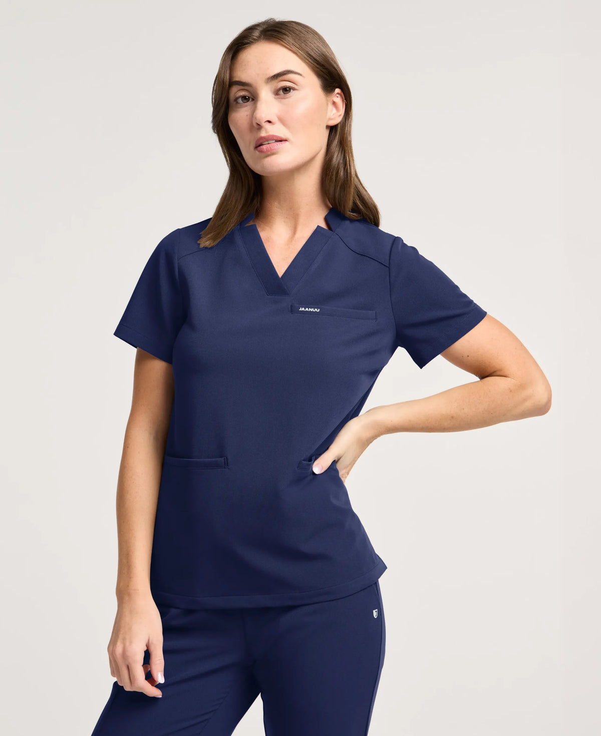 Jaanuu Helia Slim Notched V-Neck Scrub Top in Midnight Navy, product photo 1 of 6