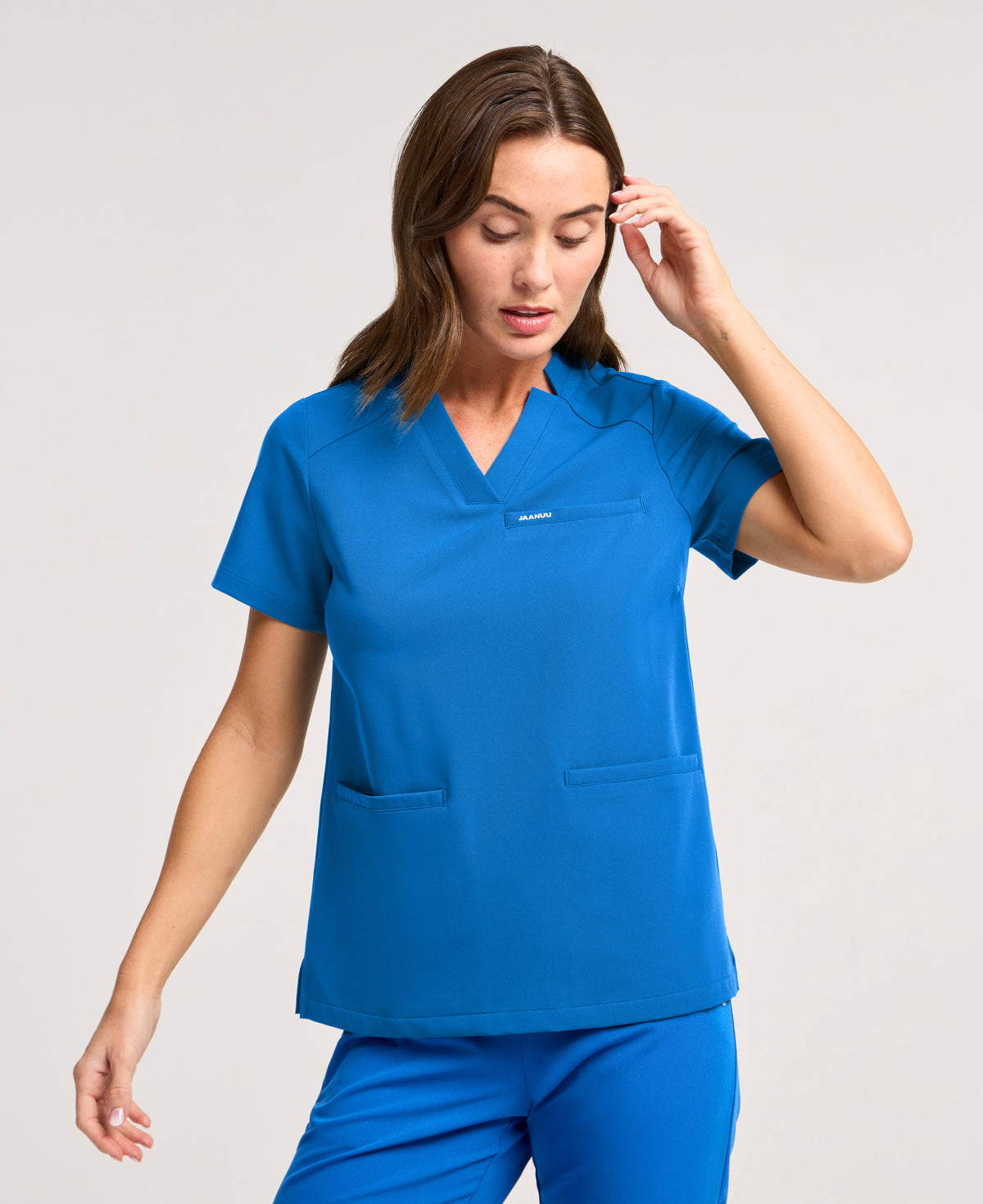 Jaanuu Helia Slim Notched V-Neck Scrub Top in Royal Blue, product photo 1 of 6