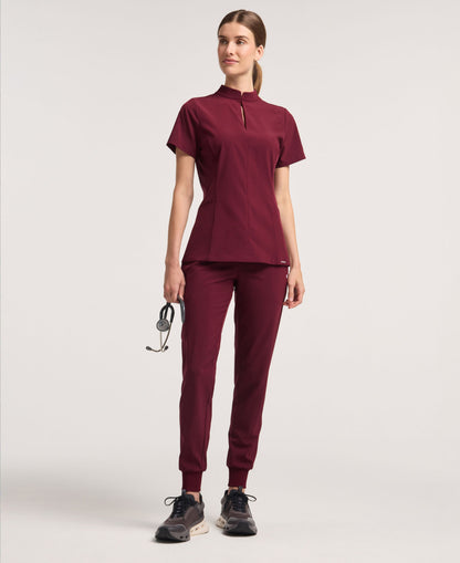 Jaanuu Alex Mock-Neck Scrub Top in Burgundy, product photo 2 of 6
