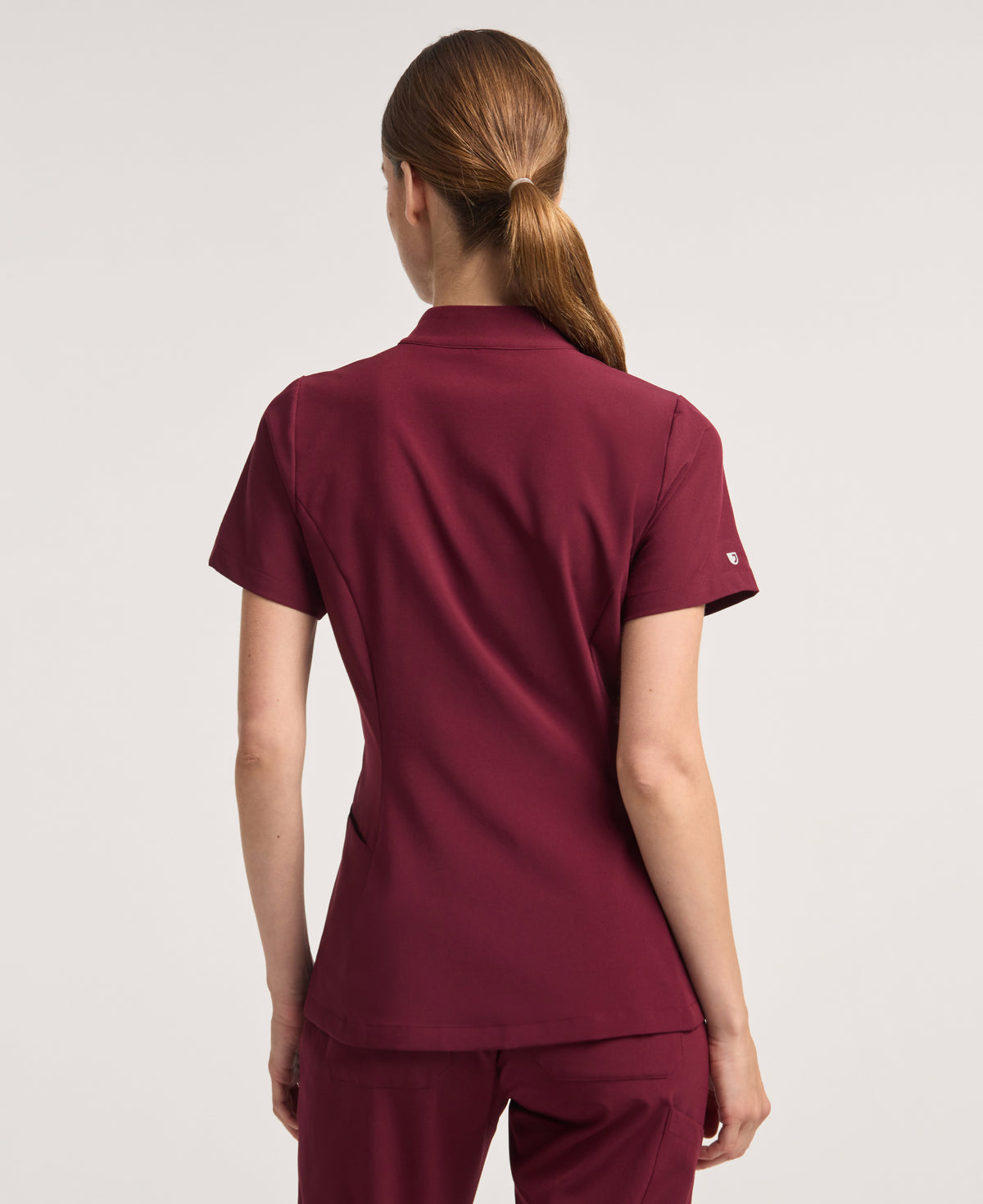 Jaanuu Alex Mock-Neck Scrub Top in Burgundy, product photo 6 of 6