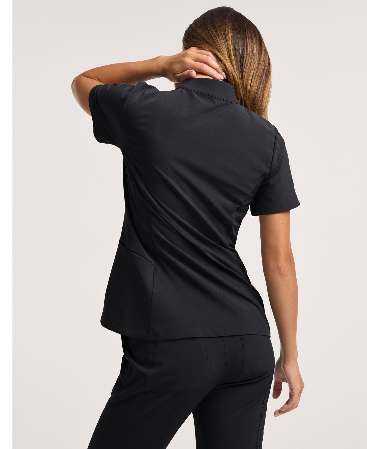 Jaanuu Alex Mock-Neck Scrub Top in Black, product photo 4 of 6