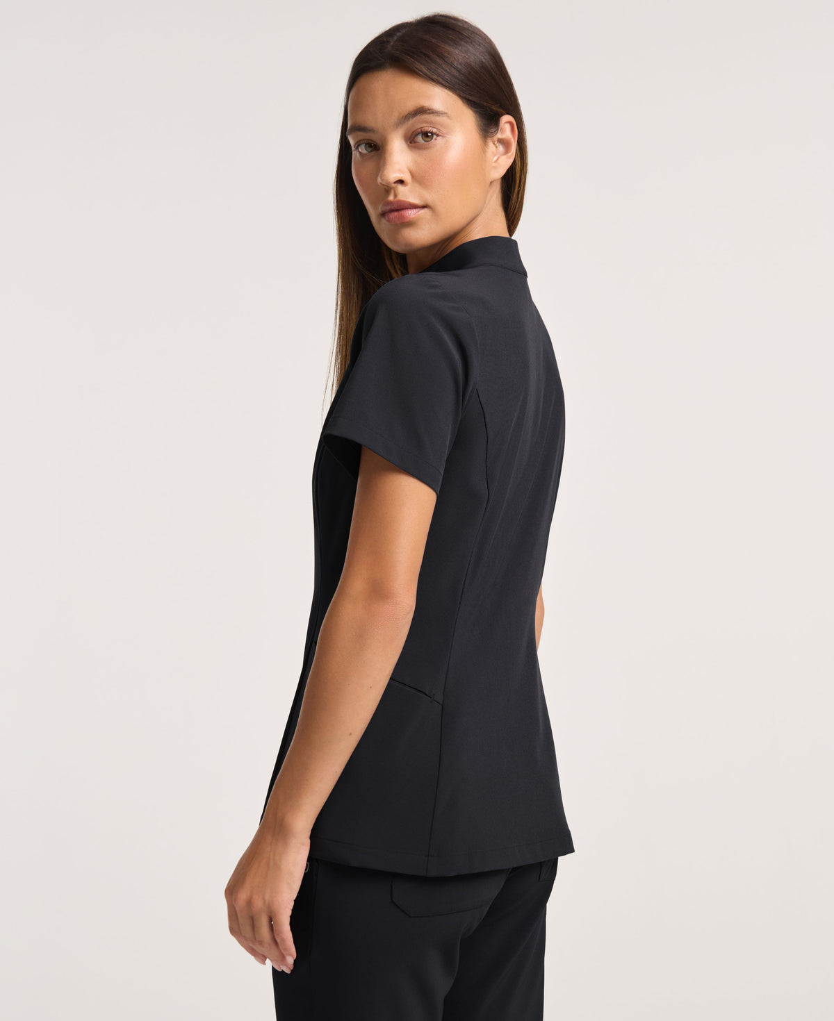 Jaanuu Alex Mock-Neck Scrub Top in Black, product photo 5 of 6