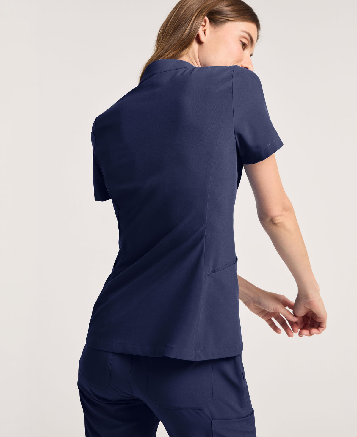 Jaanuu Alex Mock-Neck Scrub Top in Midnight Navy, product photo 5 of 6
