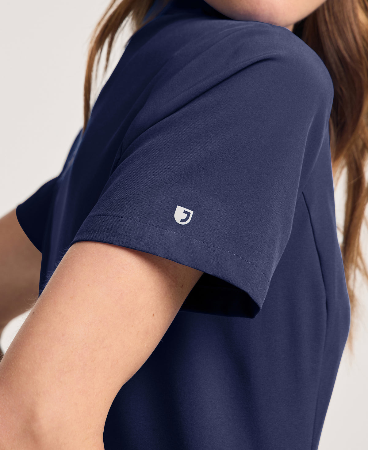 Jaanuu Alex Mock-Neck Scrub Top in Midnight Navy, product photo 6 of 6