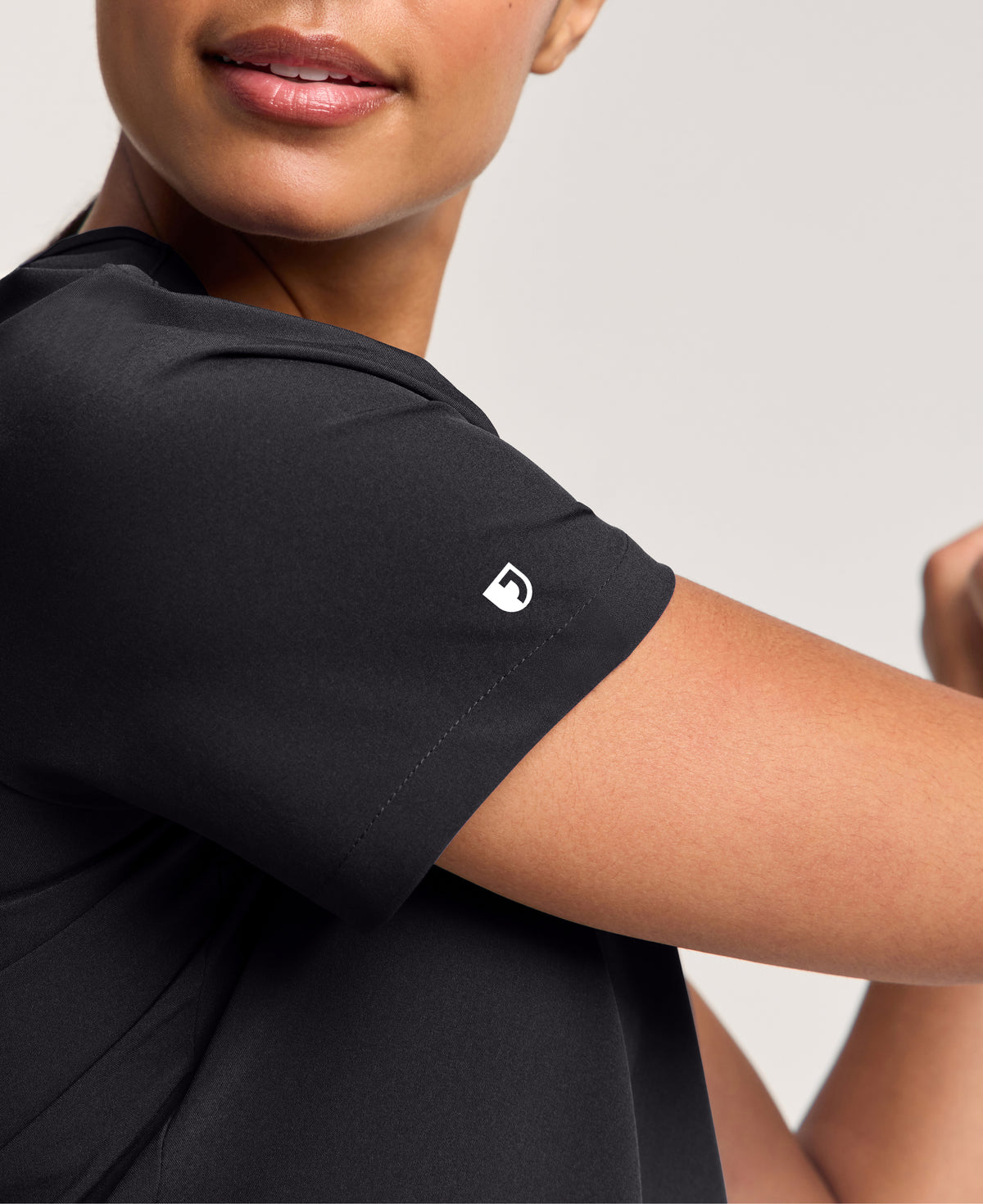 Jaanuu Harlow Slim 1-Pocket Scrub Top in Black, product photo 3 of 6