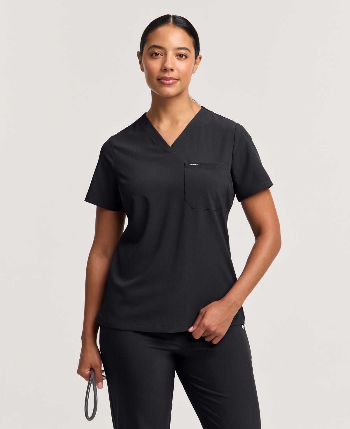 Jaanuu Harlow Slim 1-Pocket Scrub Top in Black, product photo 4 of 6