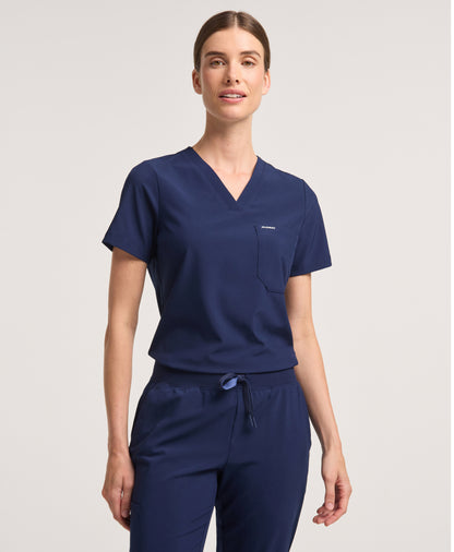 Jaanuu Harlow Slim 1-Pocket Scrub Top in Midnight Navy, product photo 1 of 6