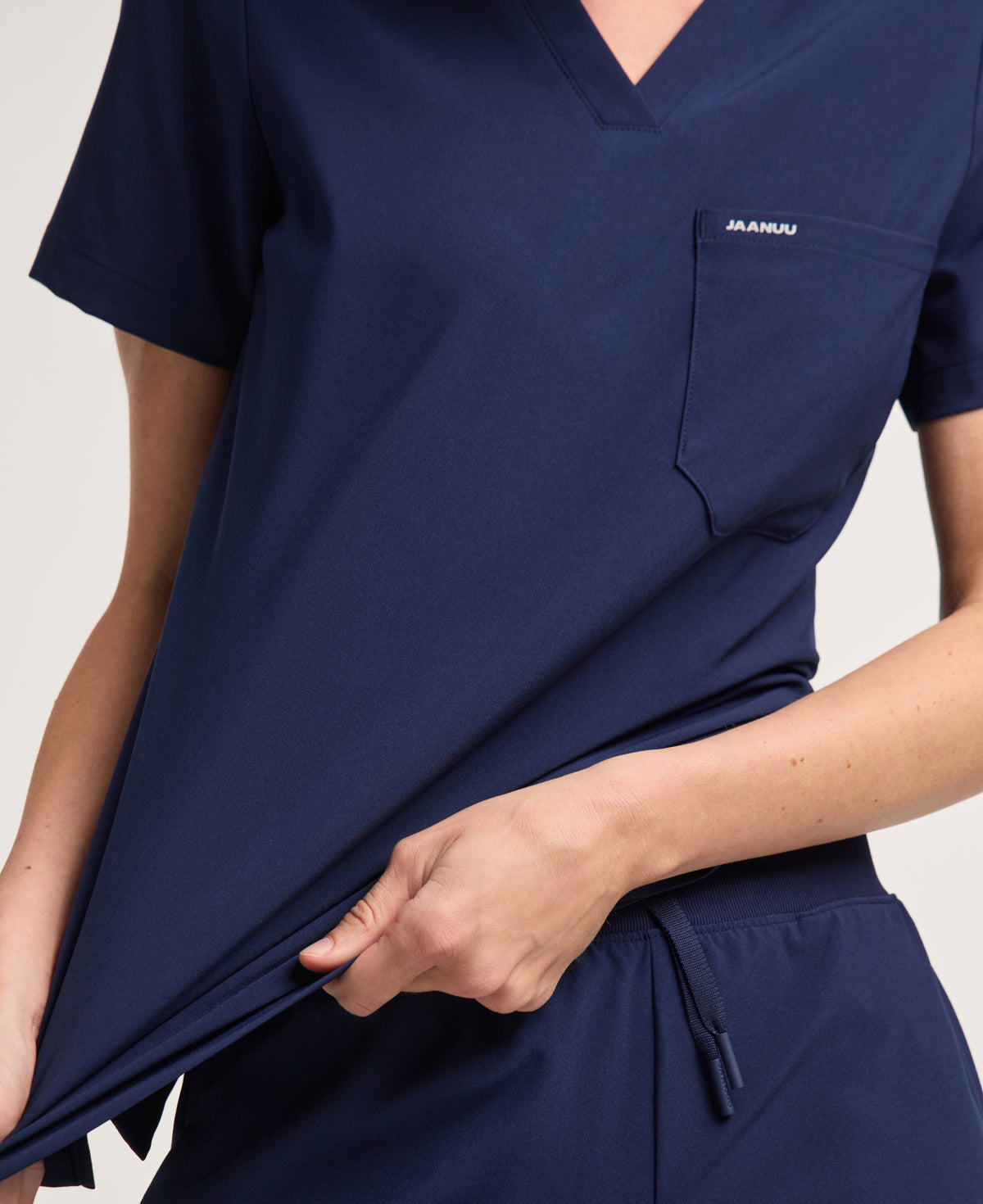 Jaanuu Harlow Slim 1-Pocket Scrub Top in Midnight Navy, product photo 5 of 6