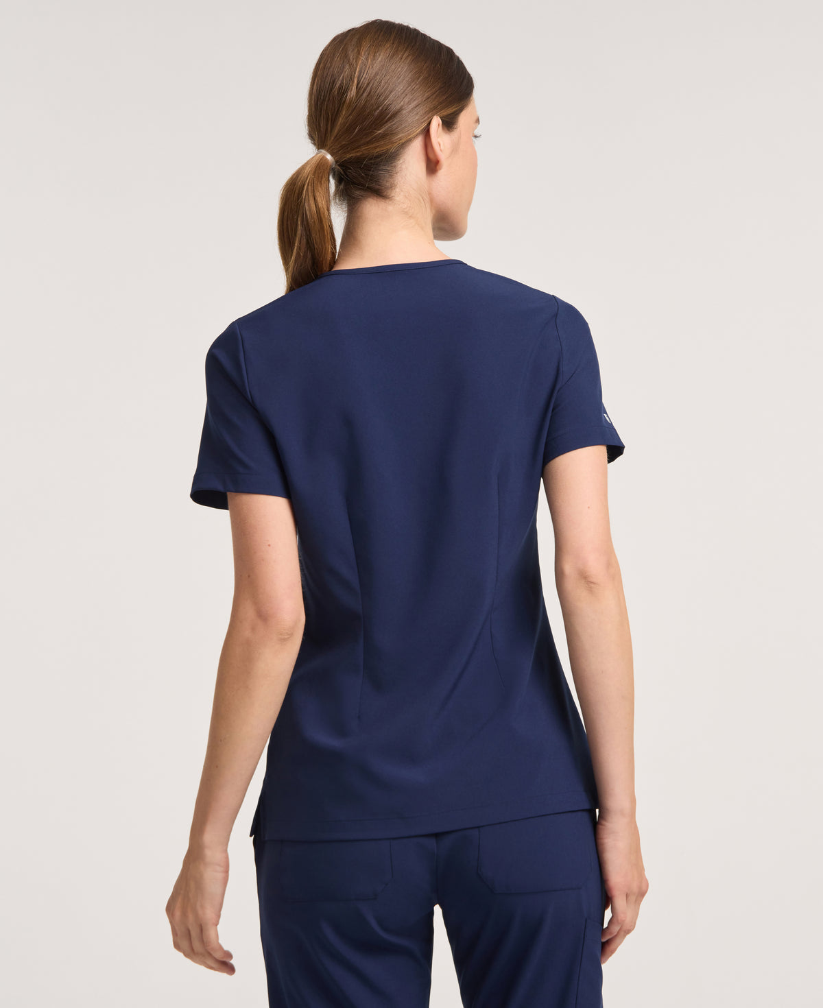 Jaanuu Harlow Slim 1-Pocket Scrub Top in Midnight Navy, product photo 6 of 6