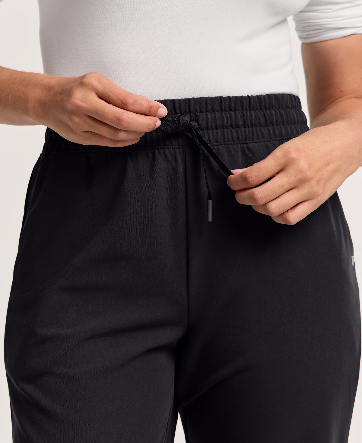 Jaanuu Kerr High Waisted Scrub Pant in Black, product photo 2 of 6