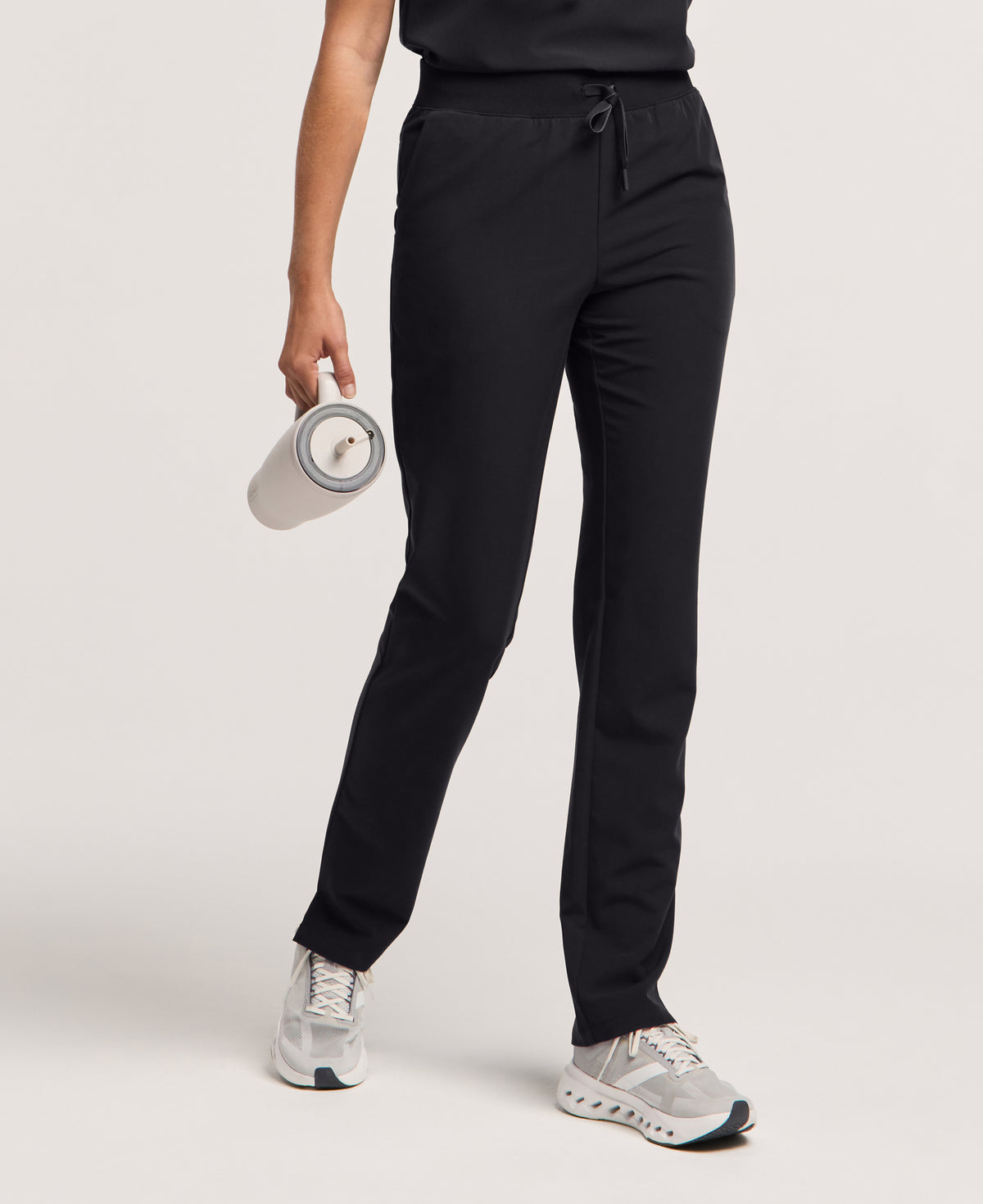 Jaanuu Xenos Slim Knit-Waist Scrub Pant in Black, product photo 1 of 6
