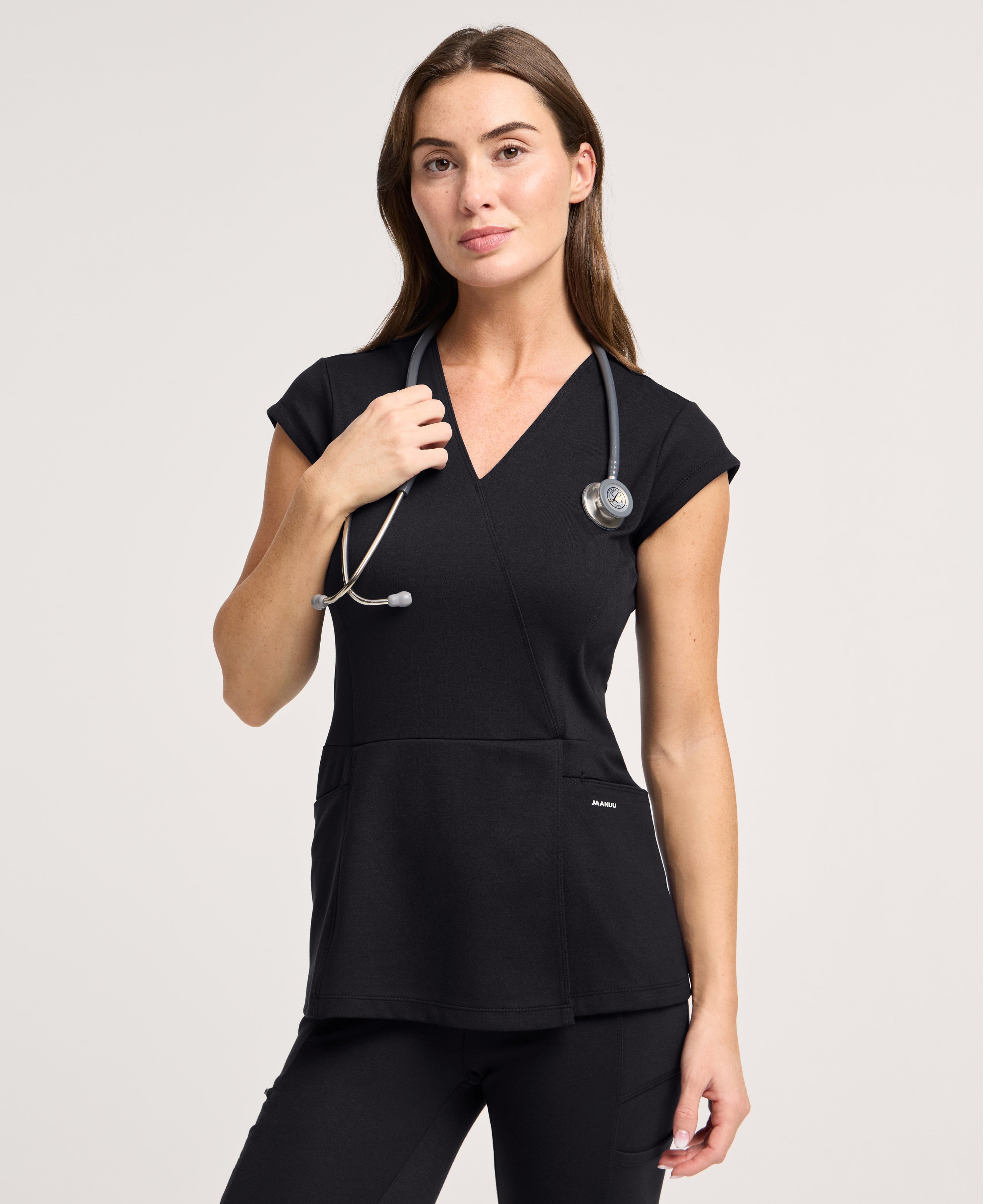 Jaanuu Isla Mock-Wrap Scrub Top in Black, product photo 1 of 6